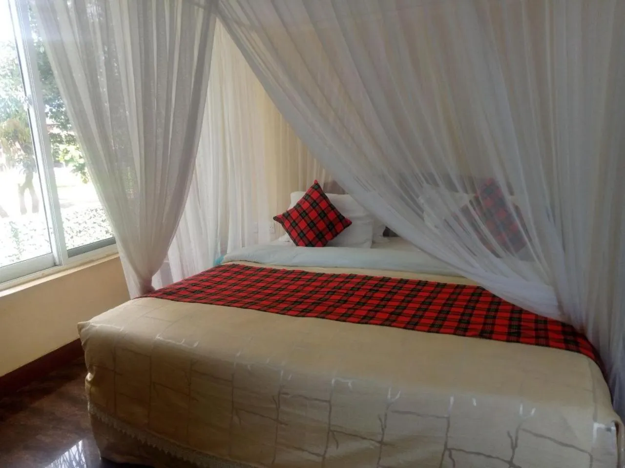 Bed in Karibu Heritage House