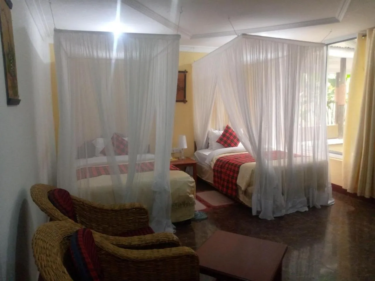 Bed in Karibu Heritage House