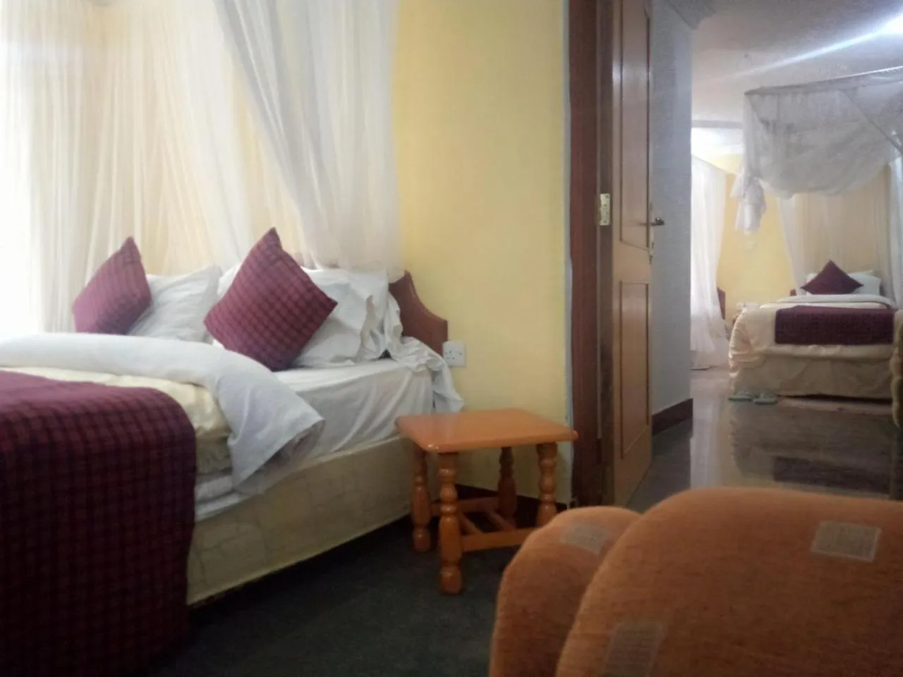 Bed in Karibu Heritage House