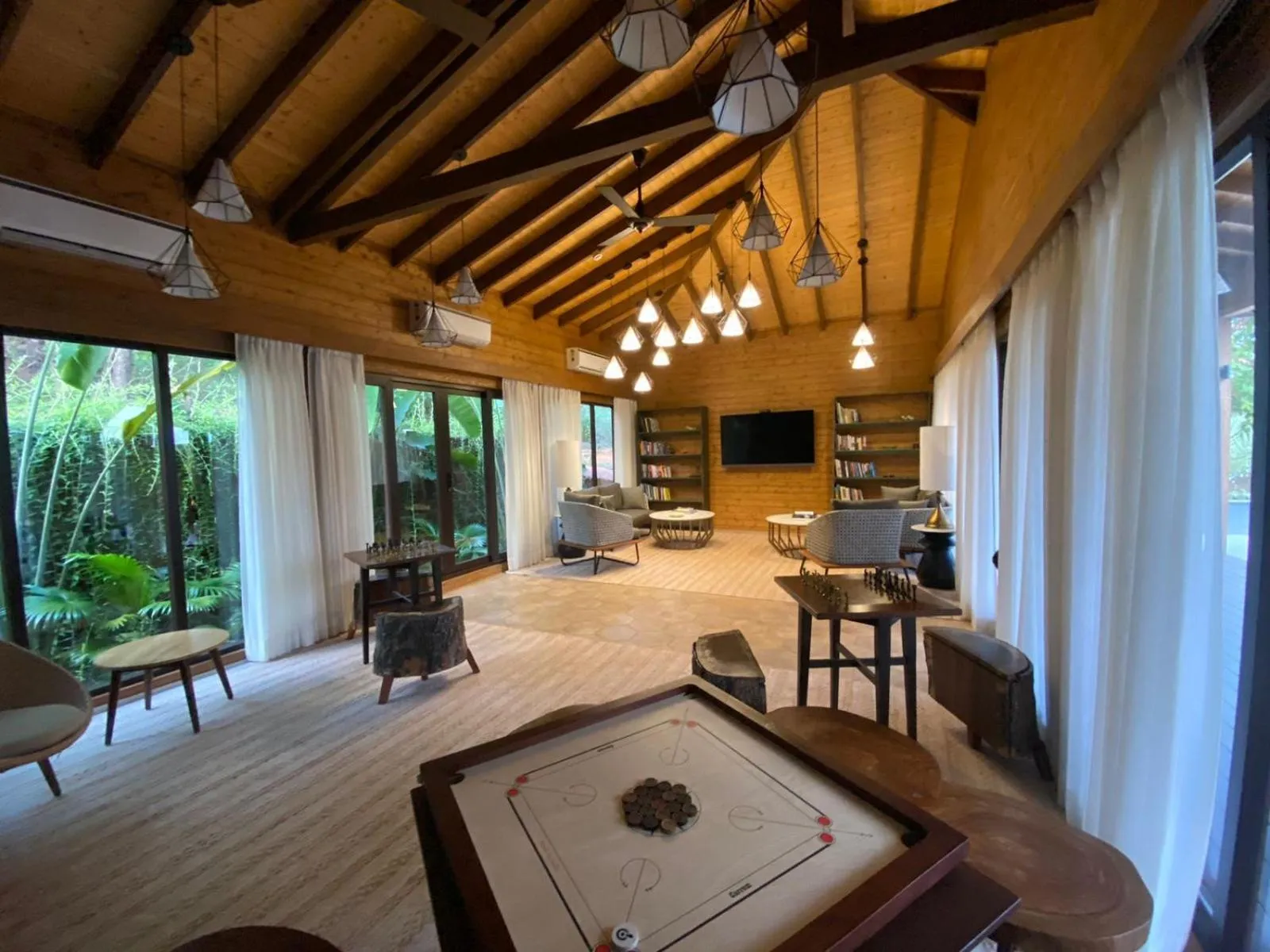 Communal lounge/ TV room in The Postcard Hideaway, Netravali Wildlife Sanctuary, Goa