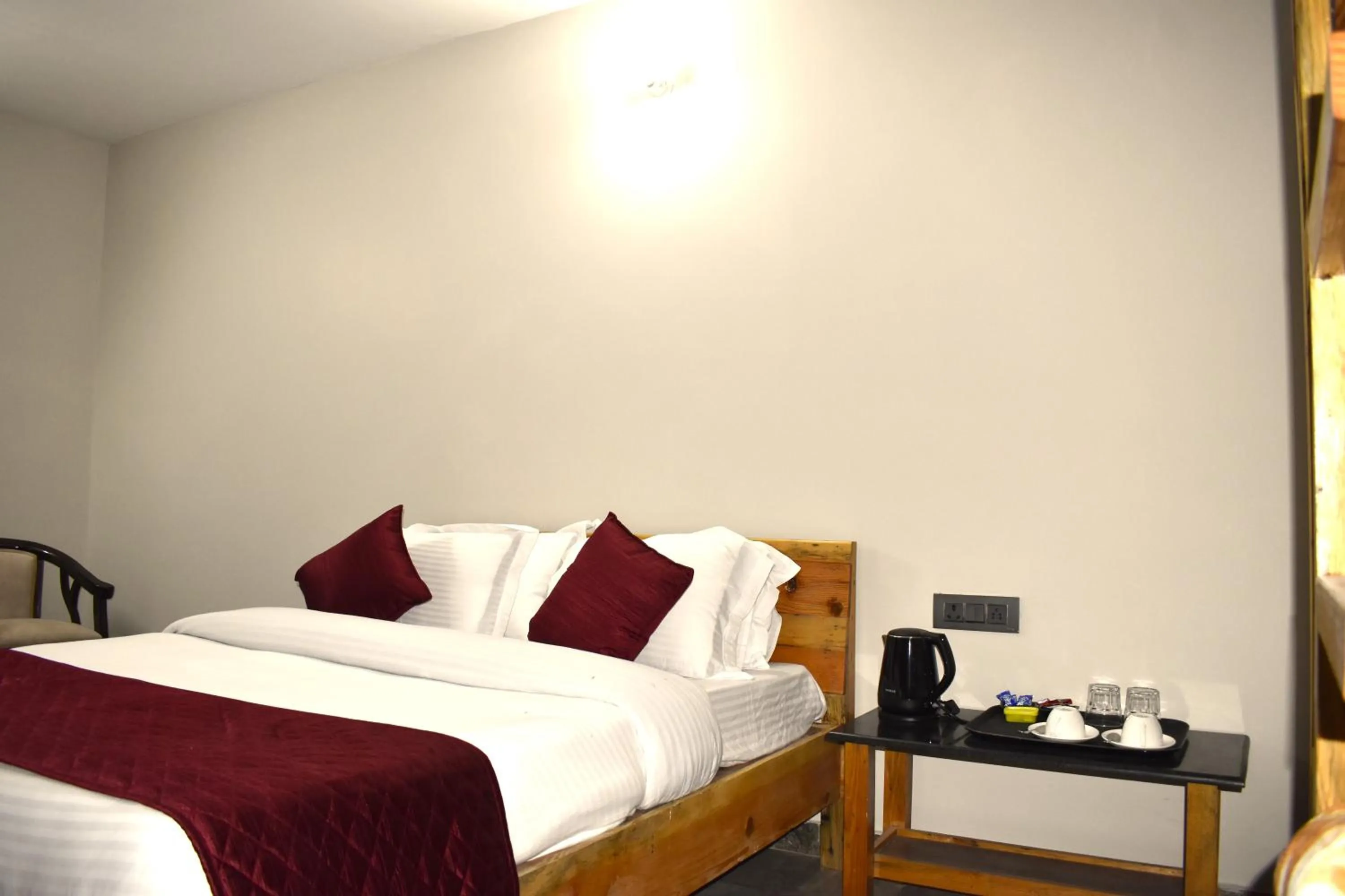 Bed in Captains Paradise Luxury Resort at Mukteshwar Hill Station