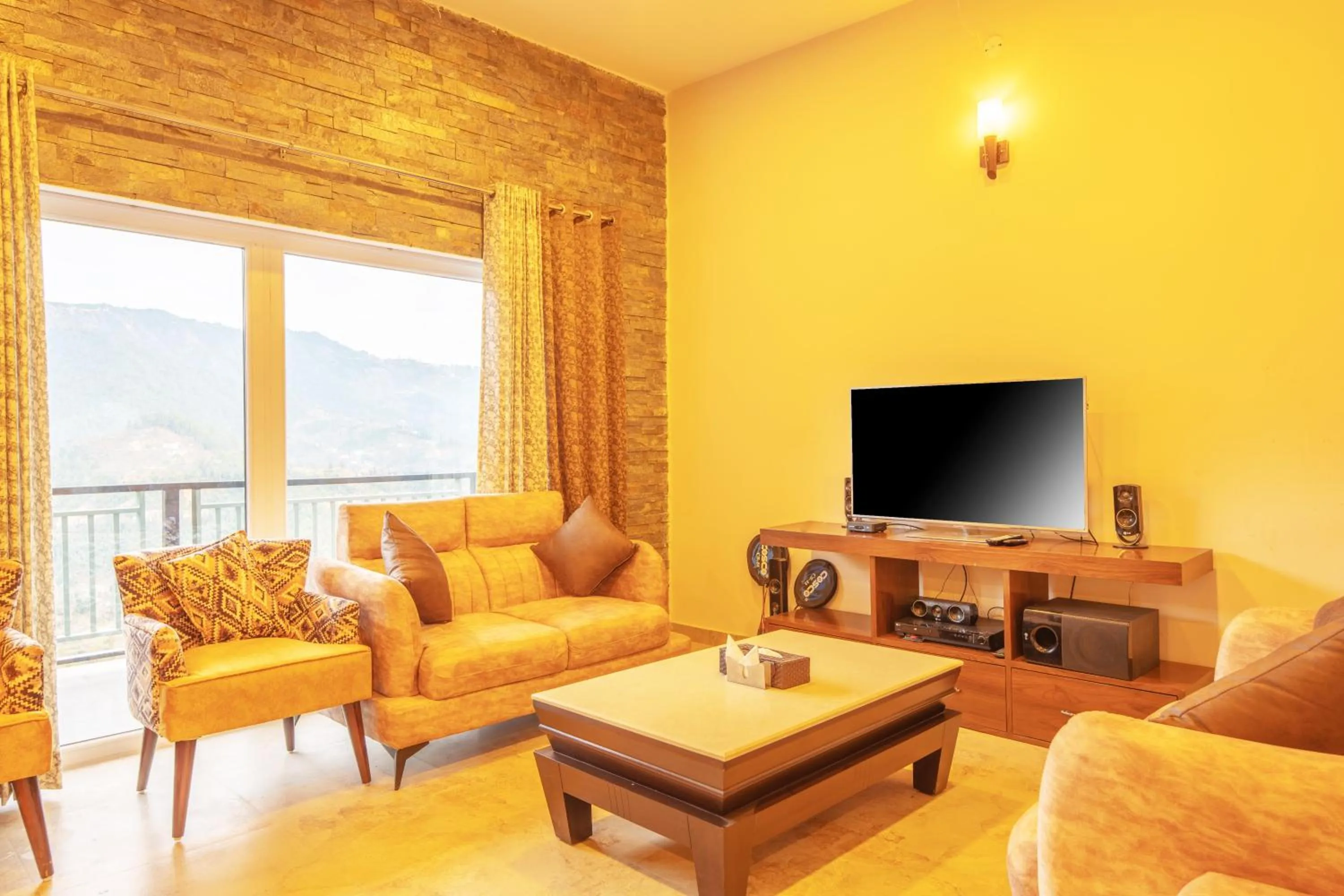 Communal lounge/ TV room in Captains Paradise Luxury Resort at Mukteshwar Hill Station
