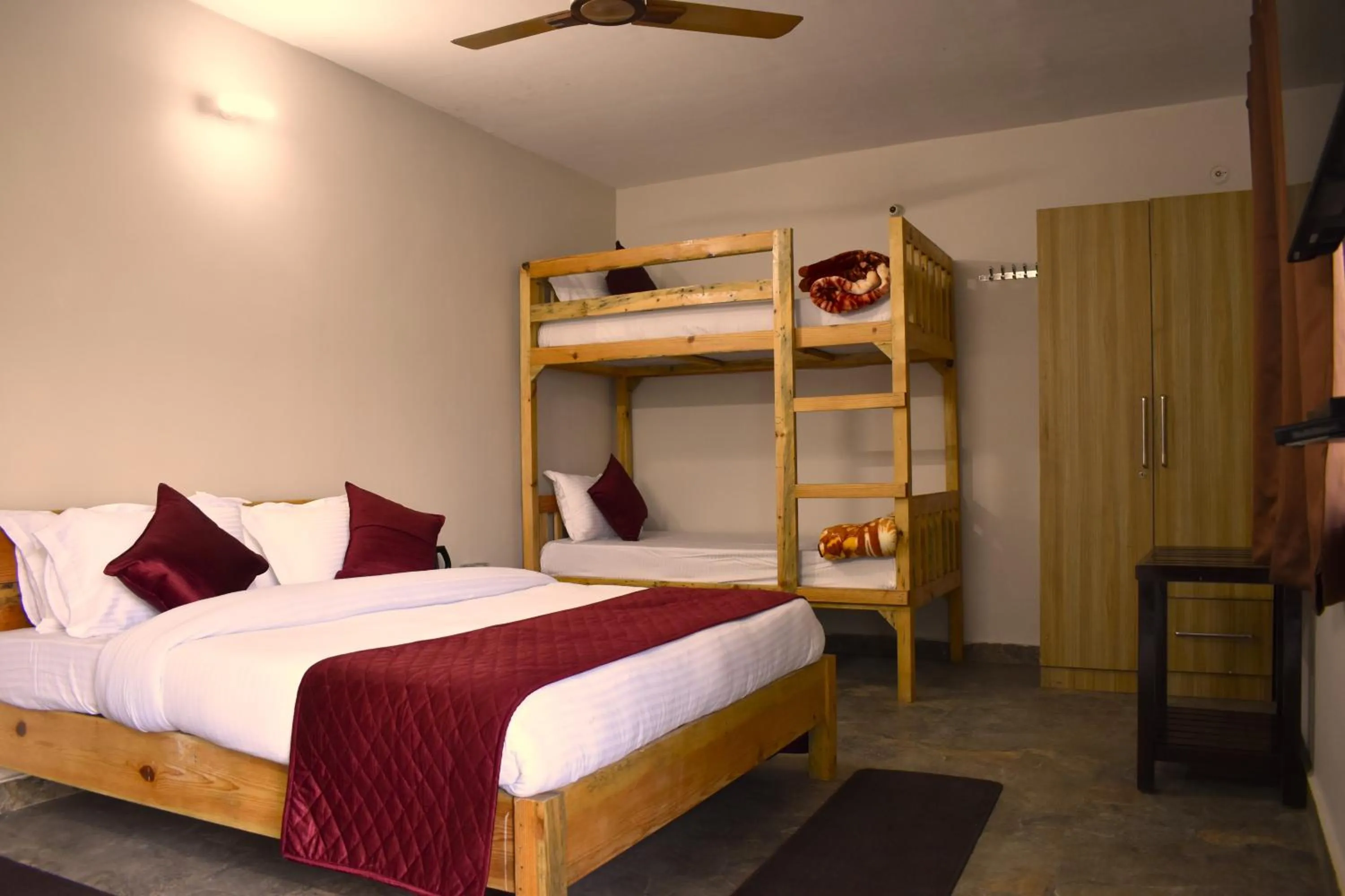 Bed in Captains Paradise Luxury Resort at Mukteshwar Hill Station