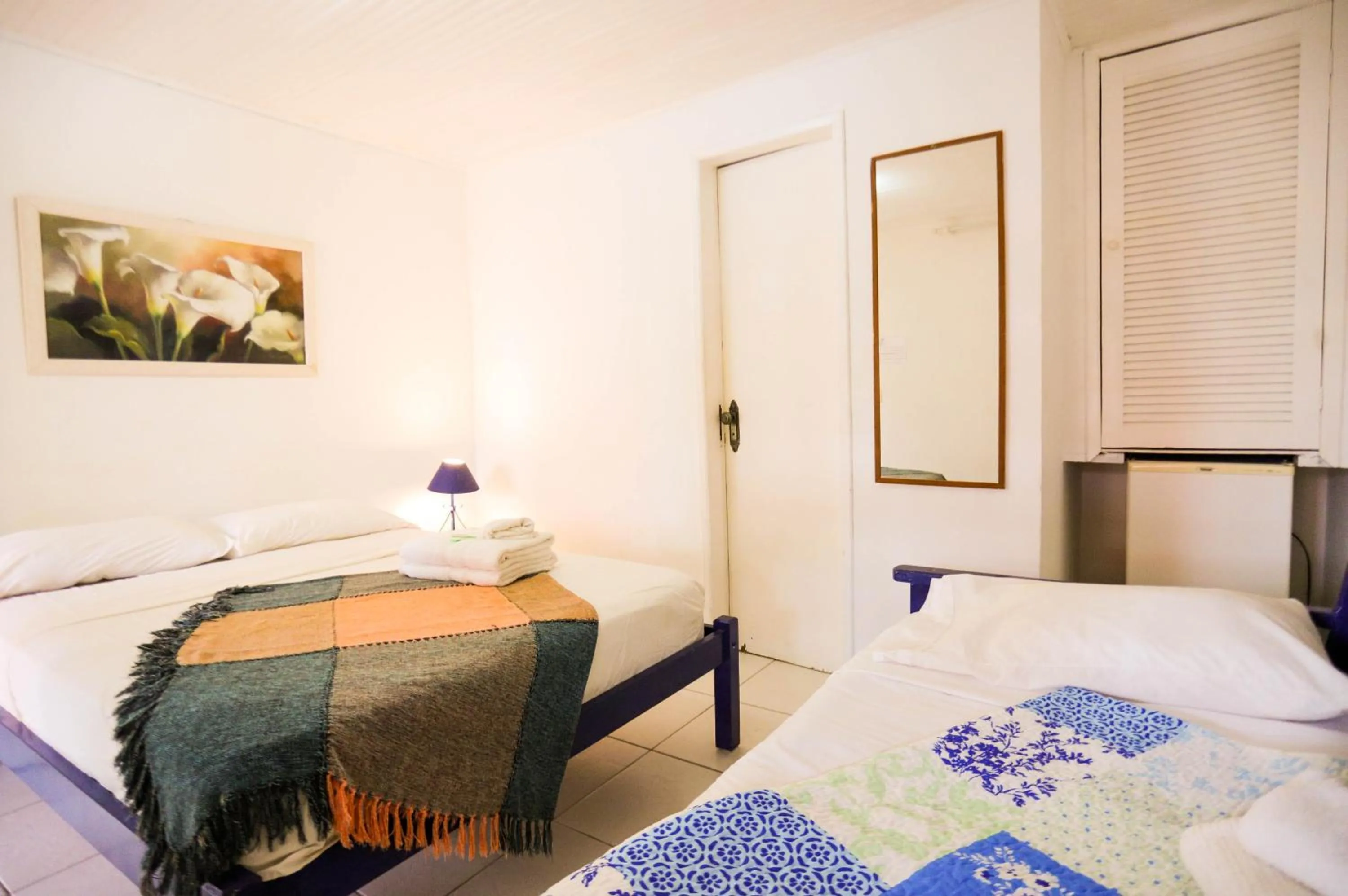 Bed in POUSADA AMENDOEIRA