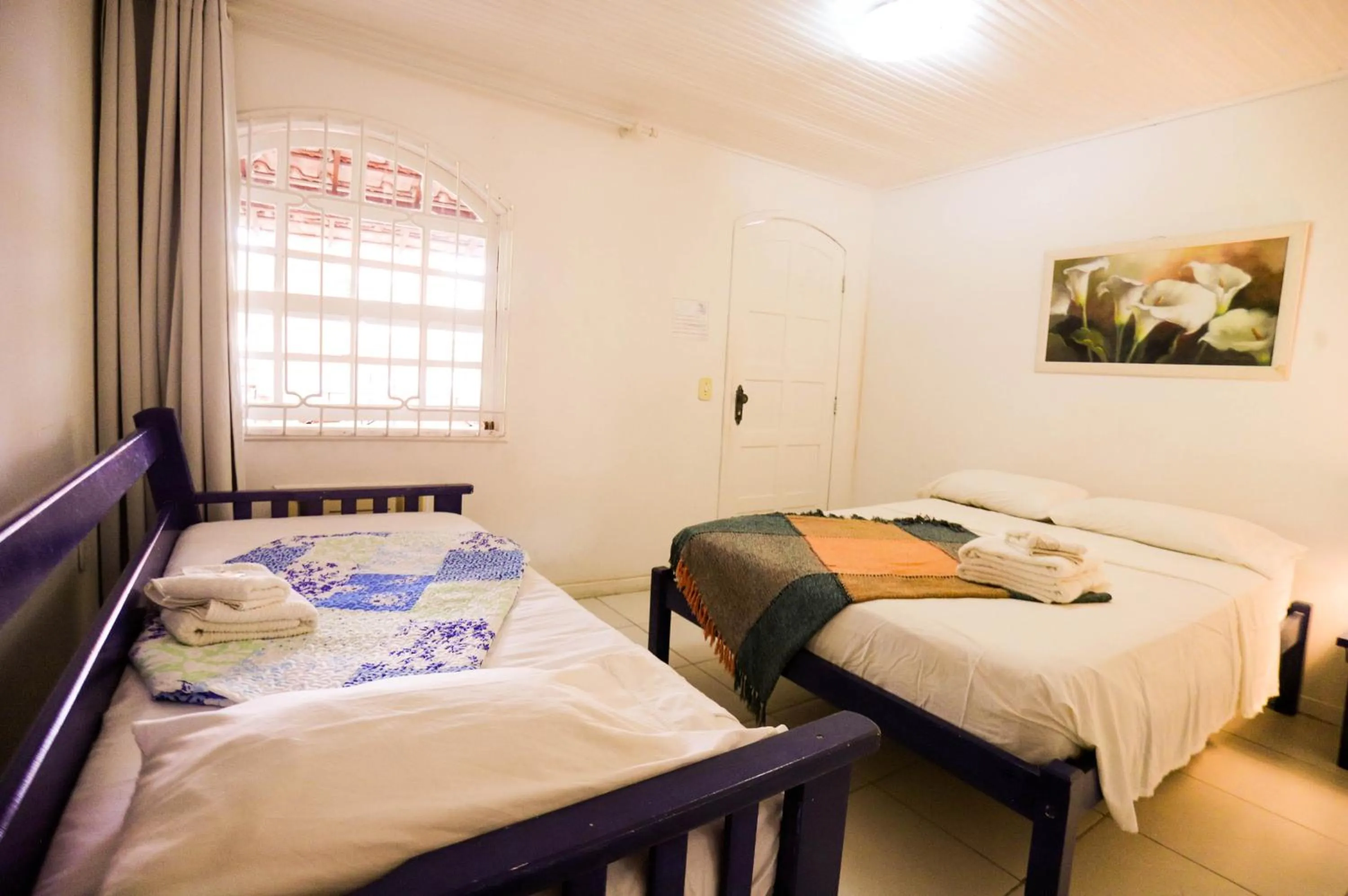 Bed in POUSADA AMENDOEIRA