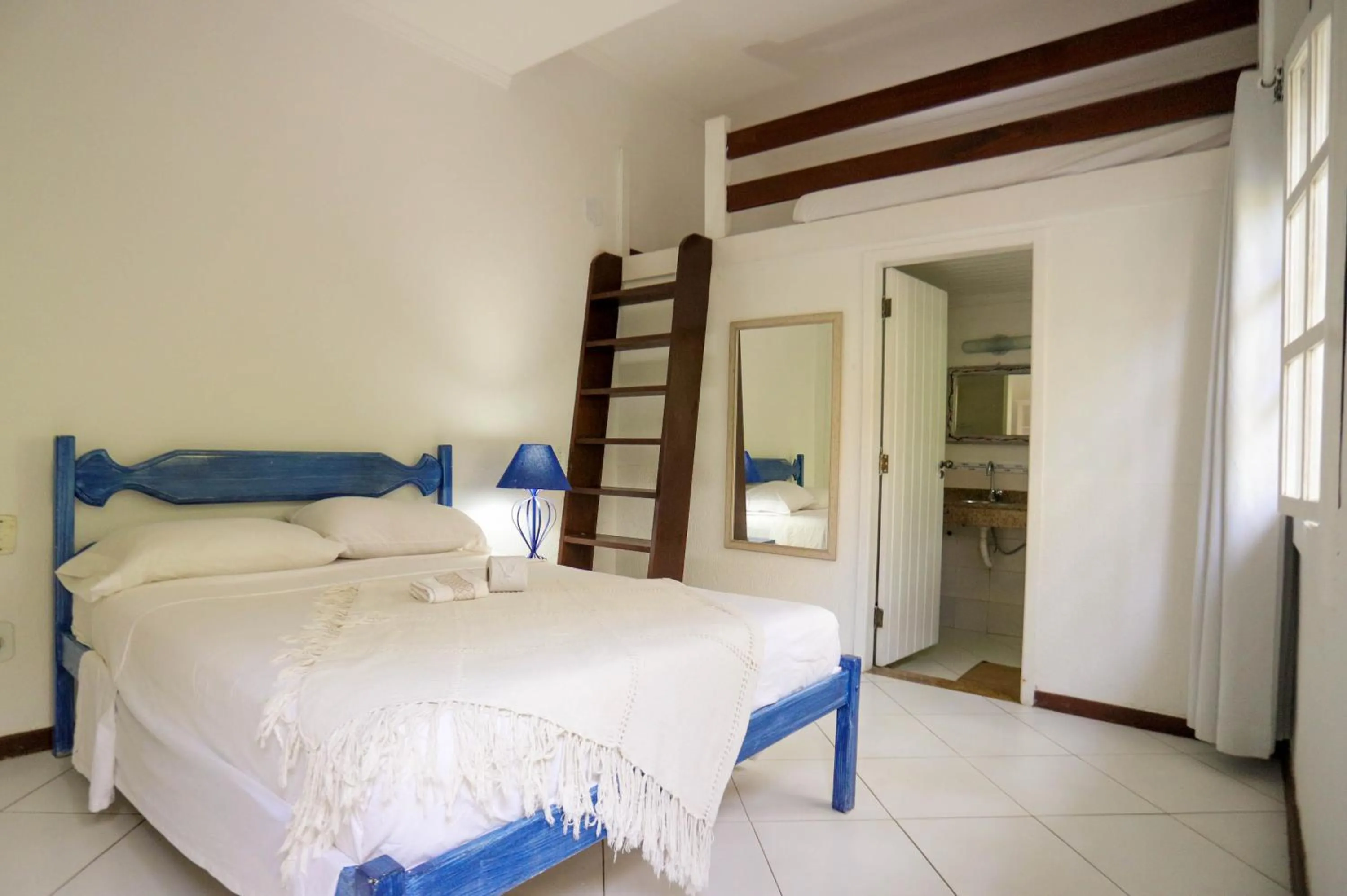 Bed in POUSADA AMENDOEIRA