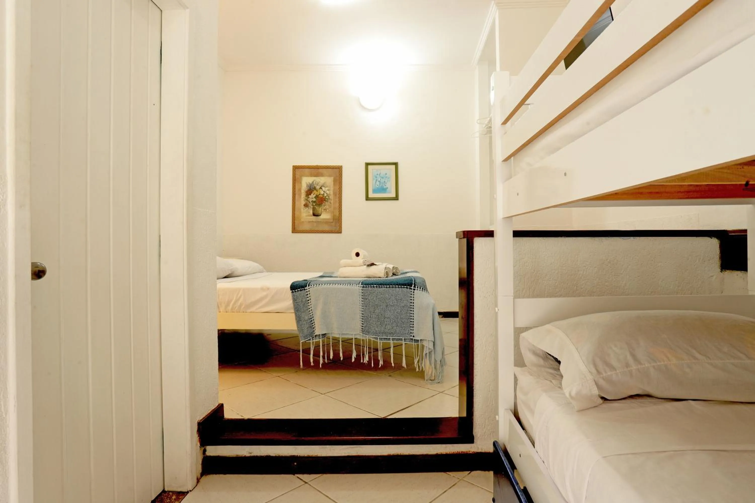 Bed in POUSADA AMENDOEIRA