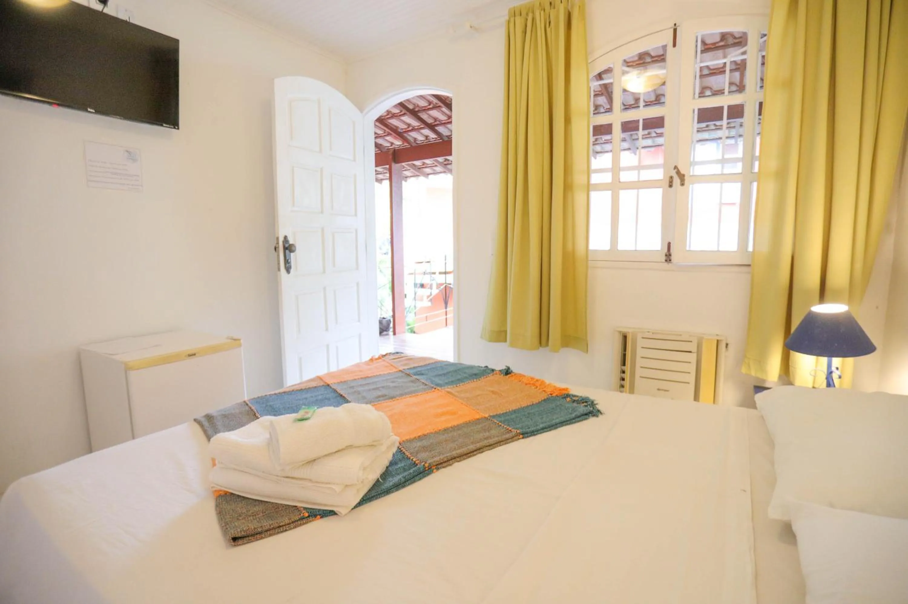 Photo of the whole room, Bed in POUSADA AMENDOEIRA