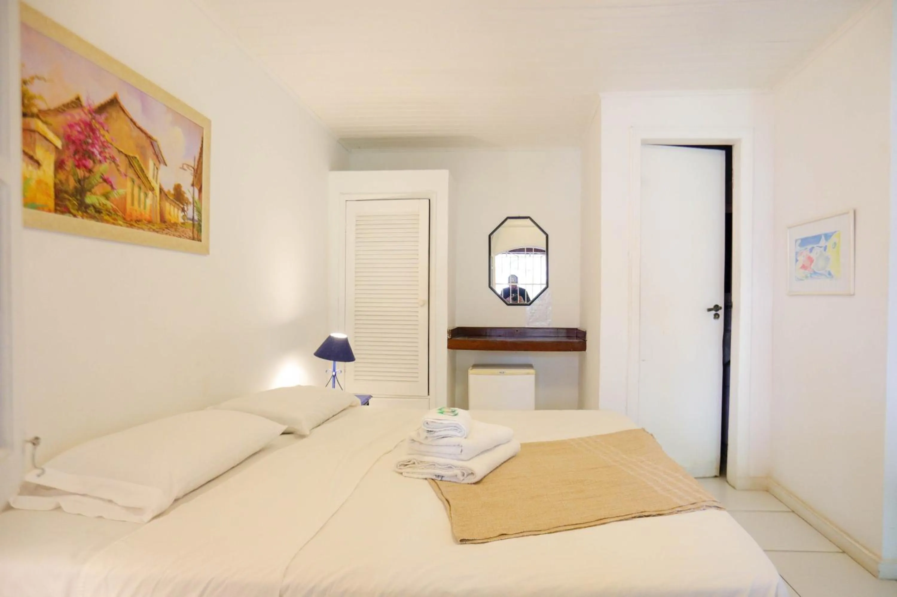 Bed in POUSADA AMENDOEIRA