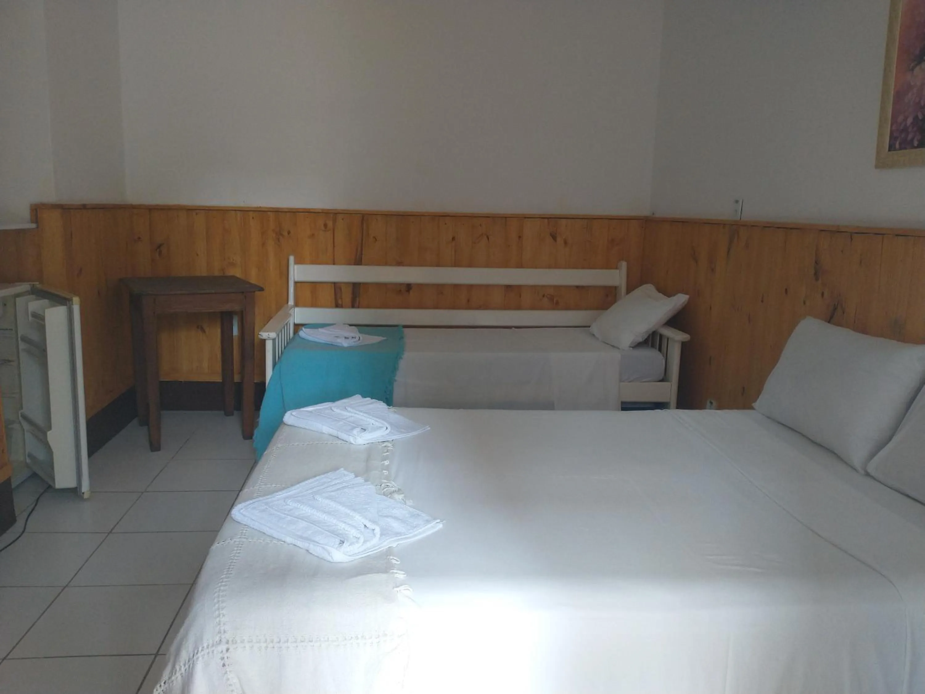 Bed in POUSADA AMENDOEIRA