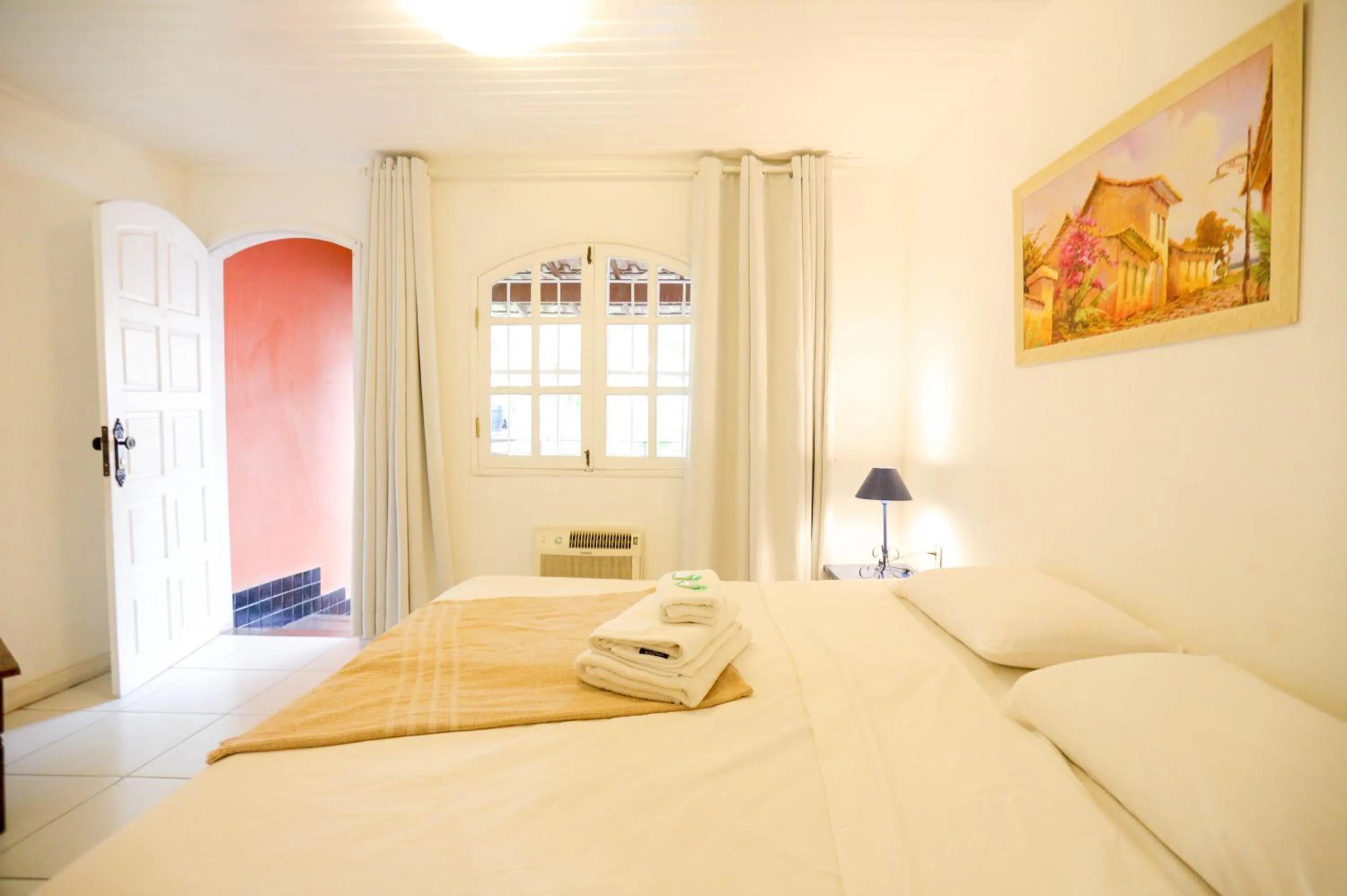 Bed in POUSADA AMENDOEIRA