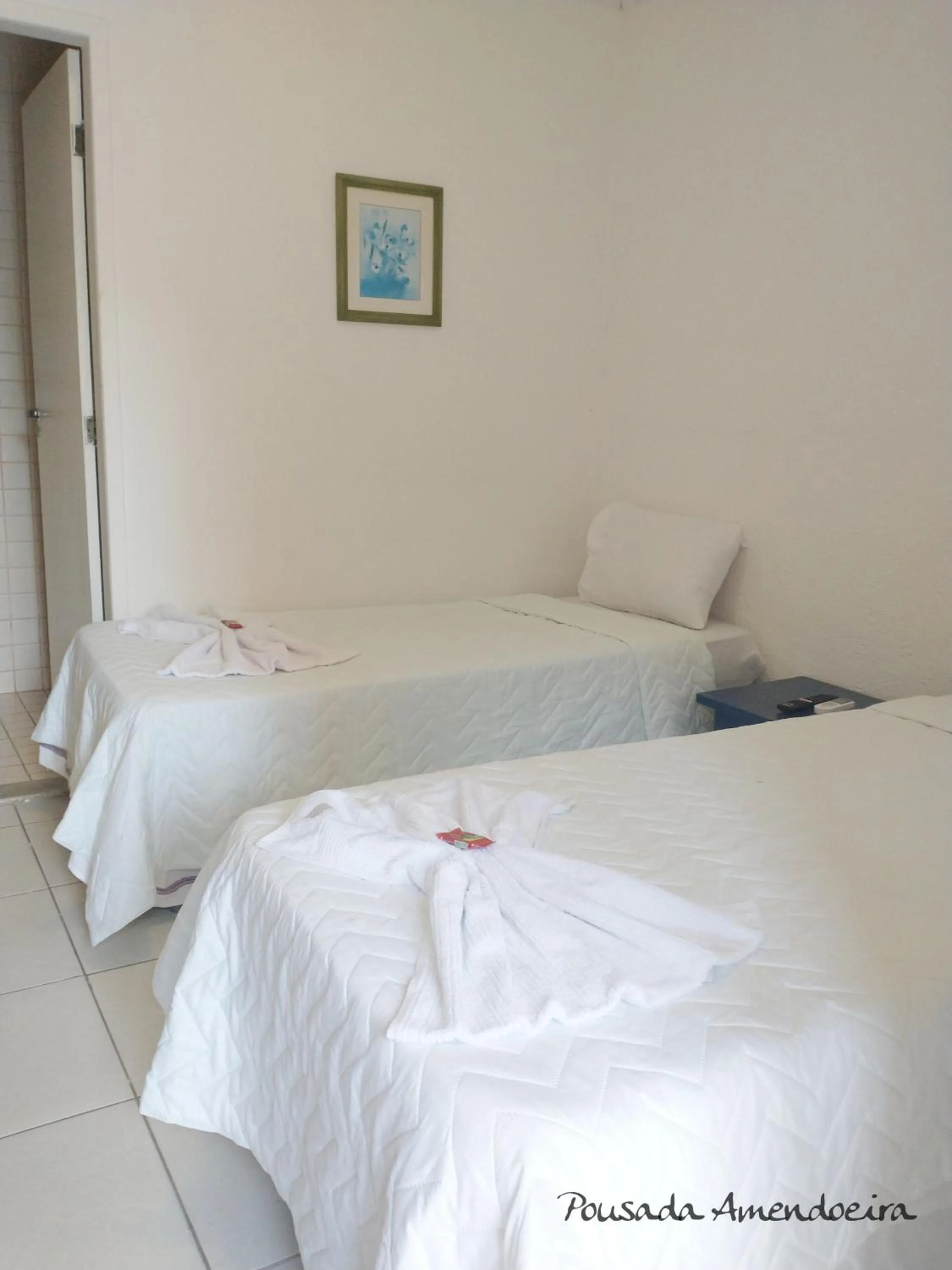 Bed in POUSADA AMENDOEIRA