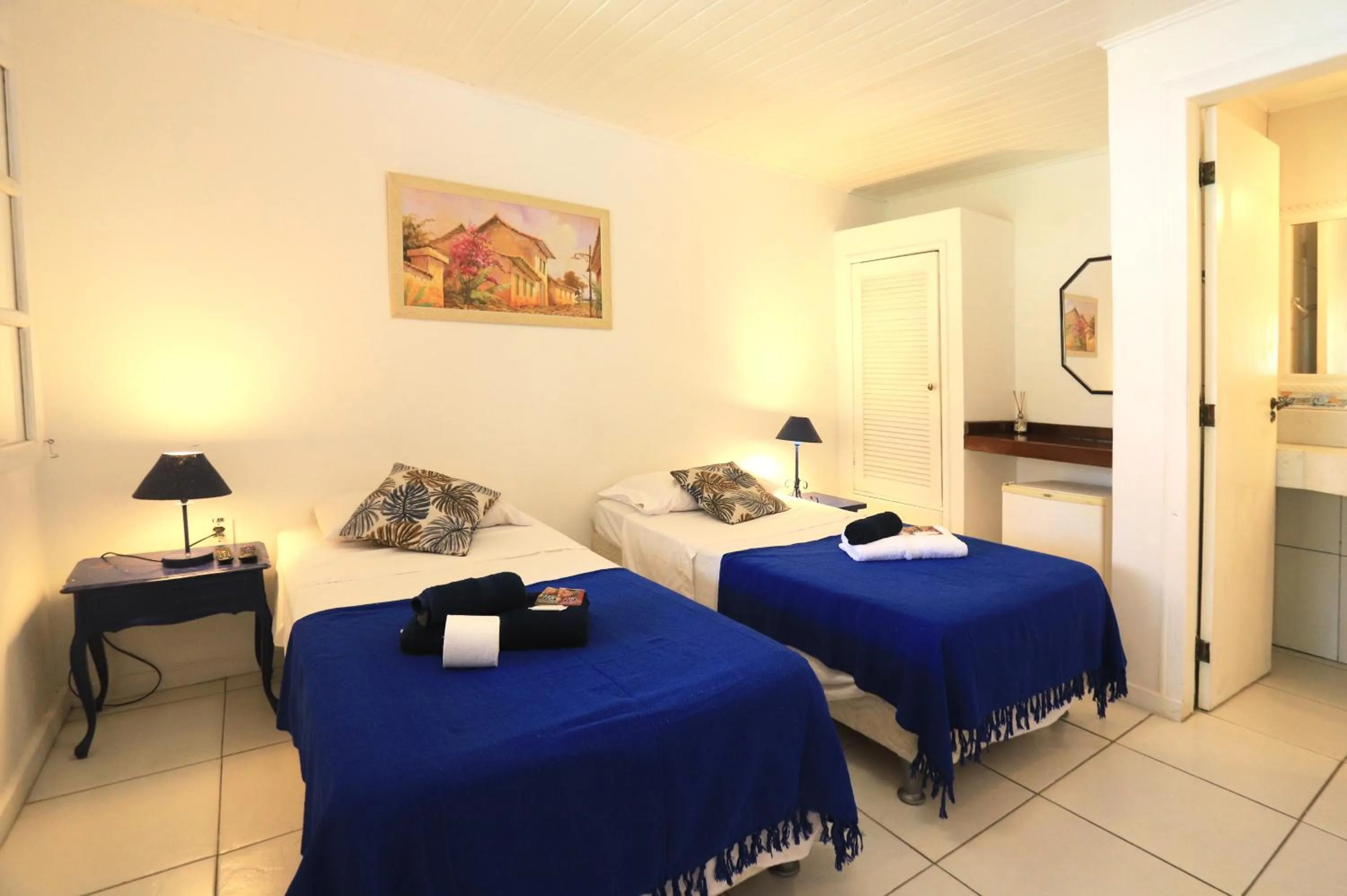 Photo of the whole room, Bed in POUSADA AMENDOEIRA