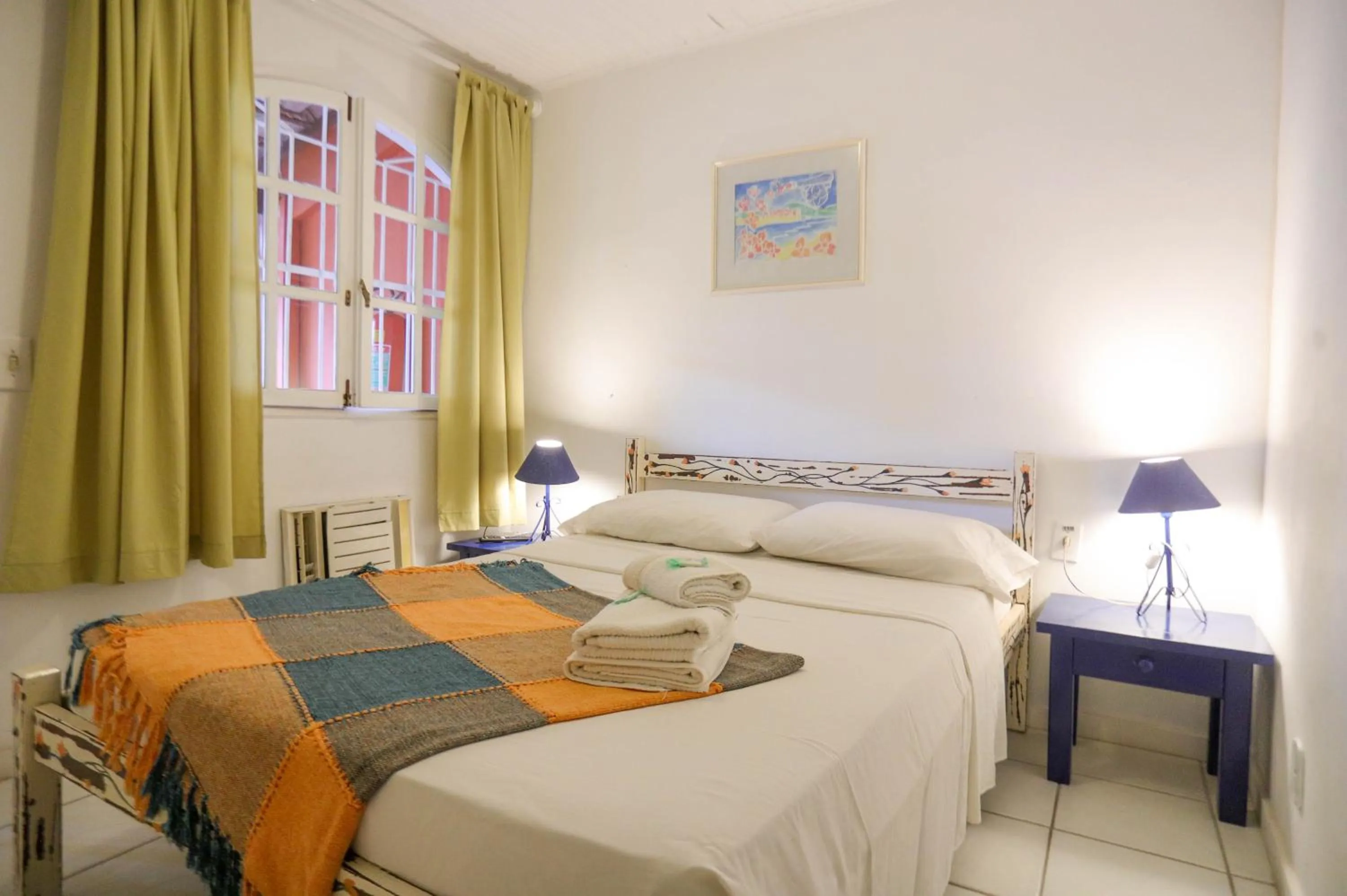 Photo of the whole room, Bed in POUSADA AMENDOEIRA