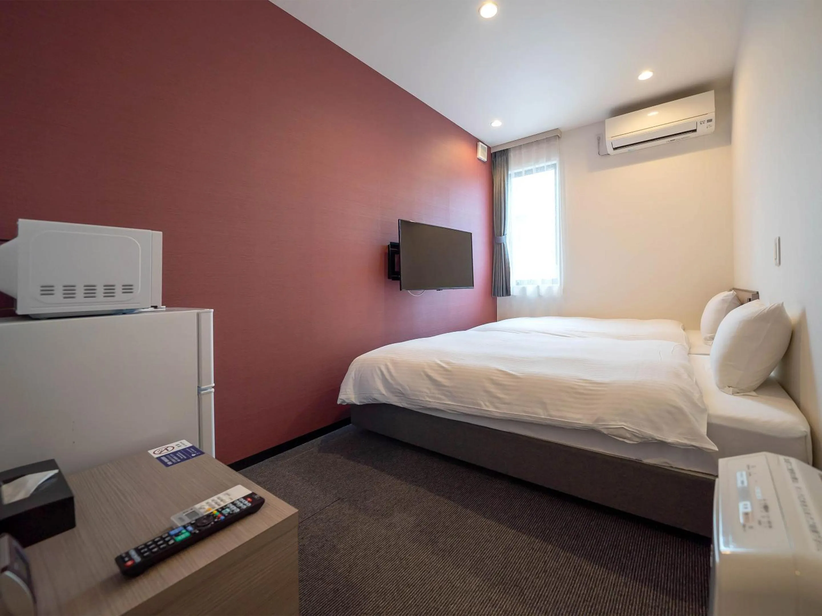 Photo of the whole room, Bed in HOTEL R9 The Yard Uruma