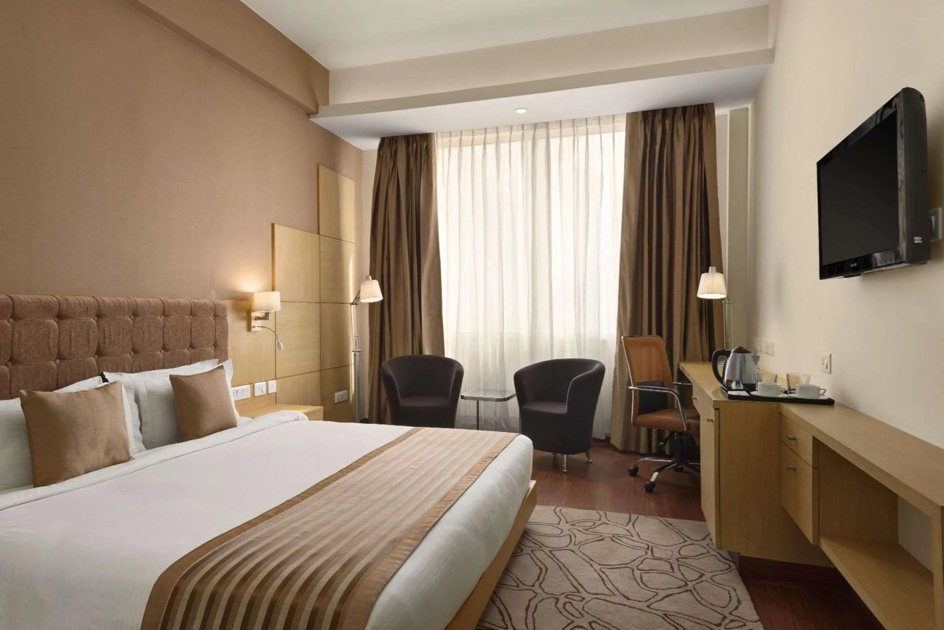 Photo of the whole room, Bed in Ramada Neemrana