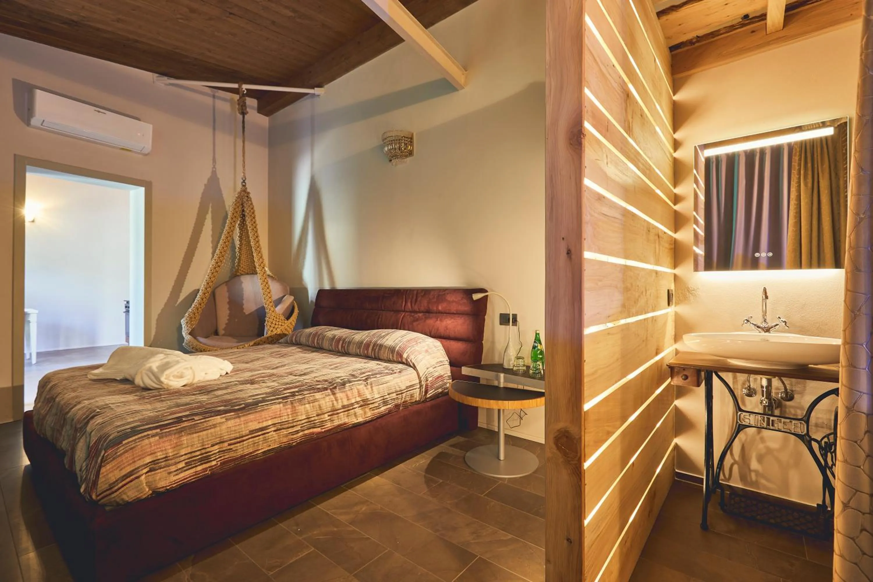 Bed in Le Stagioni Luxury Suite