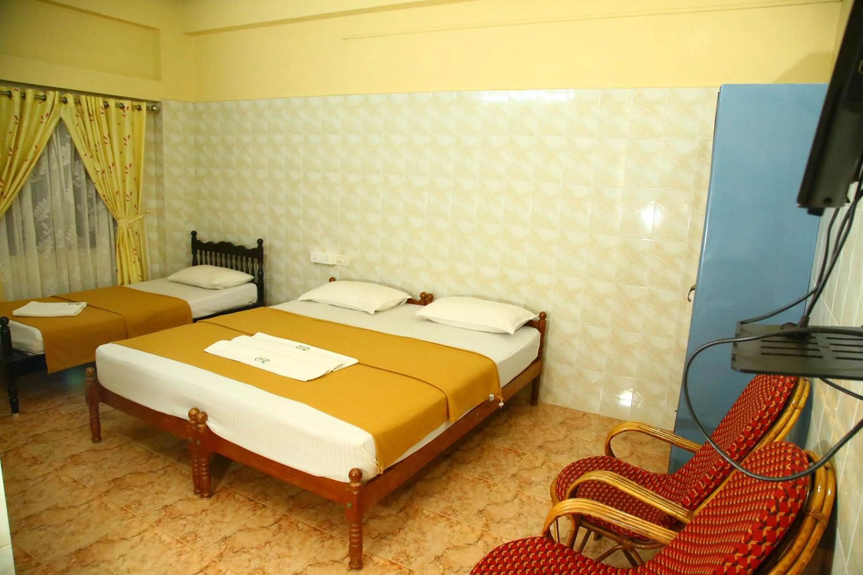 Bed in Lake Palace Family Resort Kumarakom