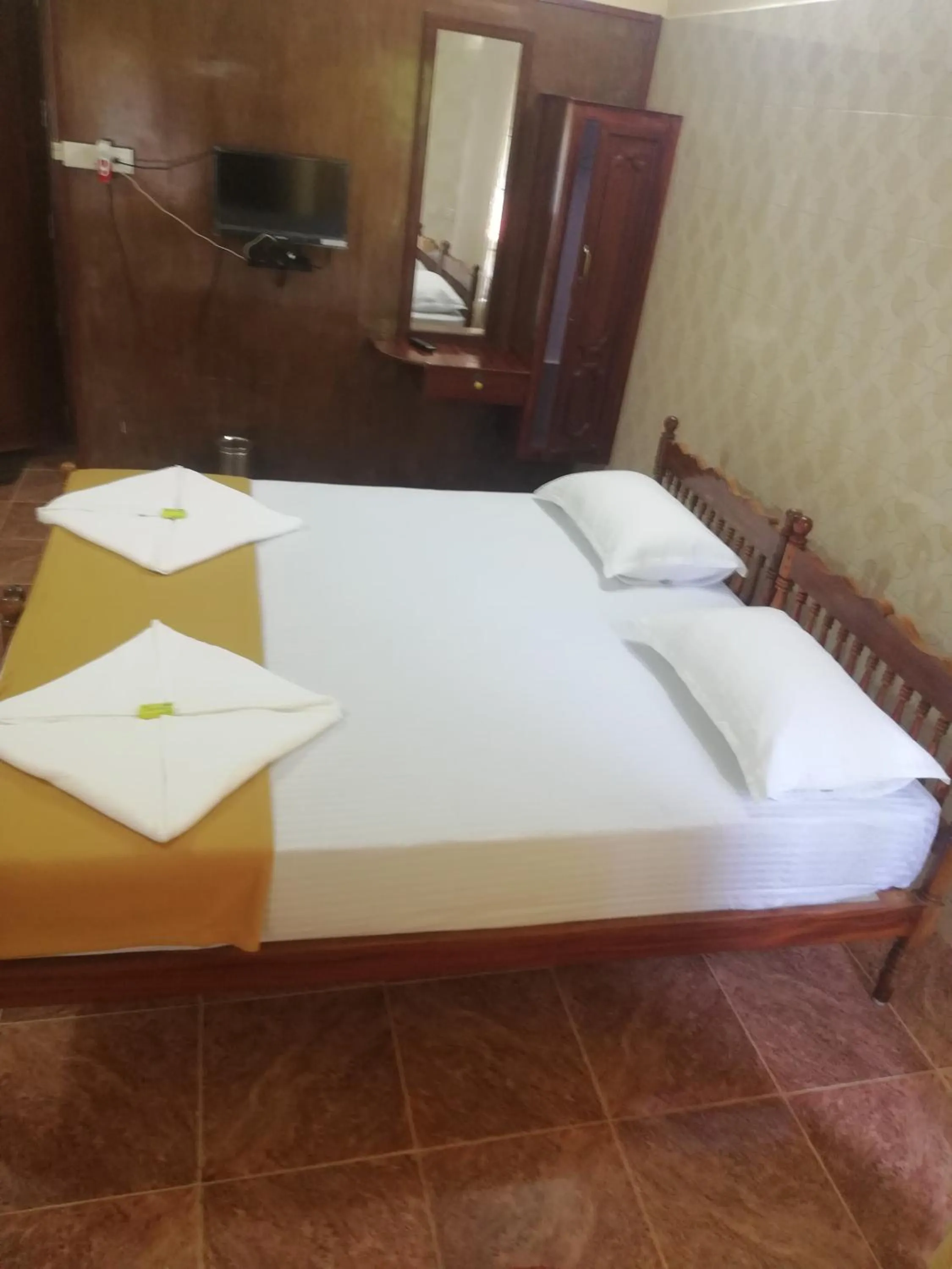 Bed in Lake Palace Family Resort Kumarakom