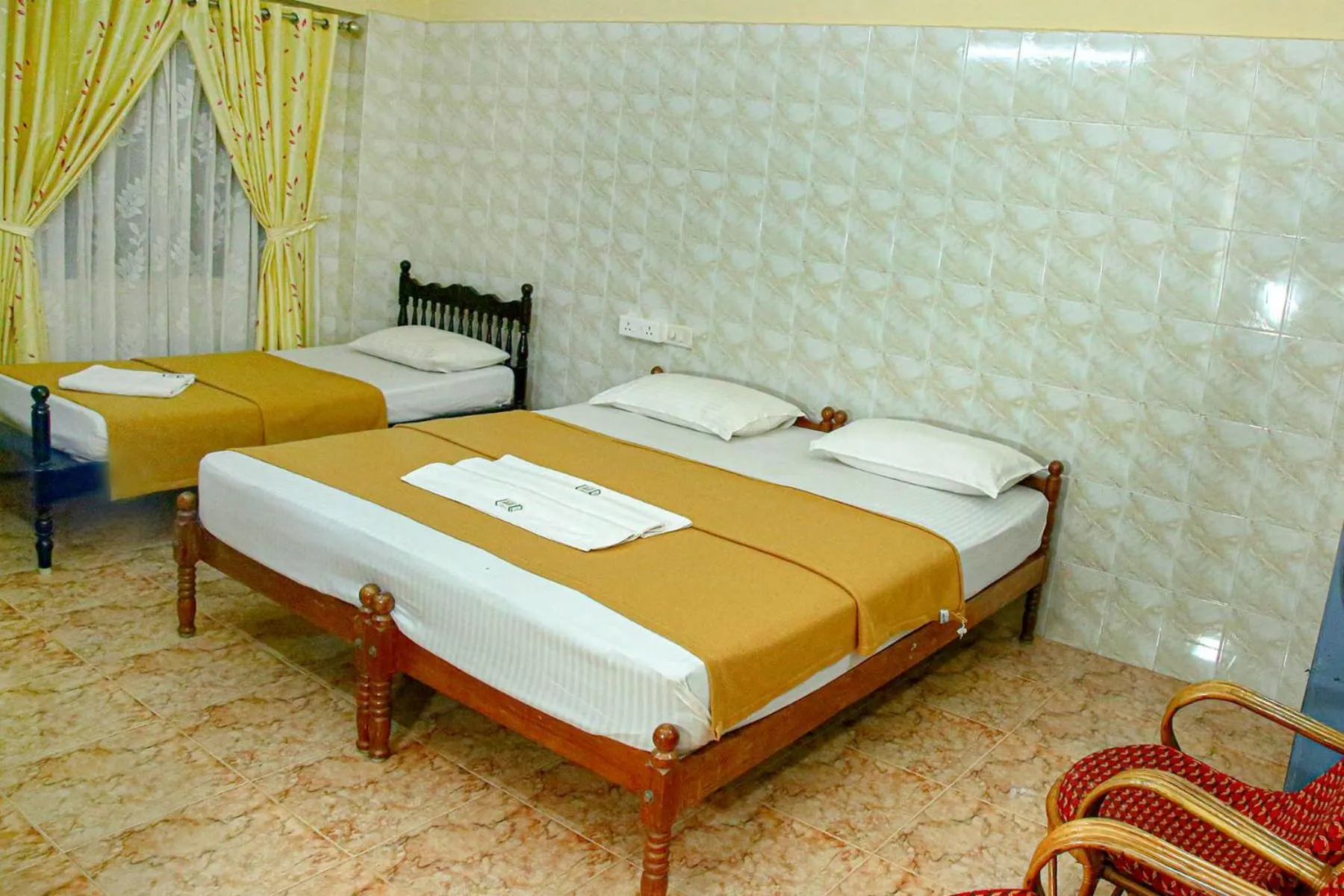 Bed in Lake Palace Family Resort Kumarakom