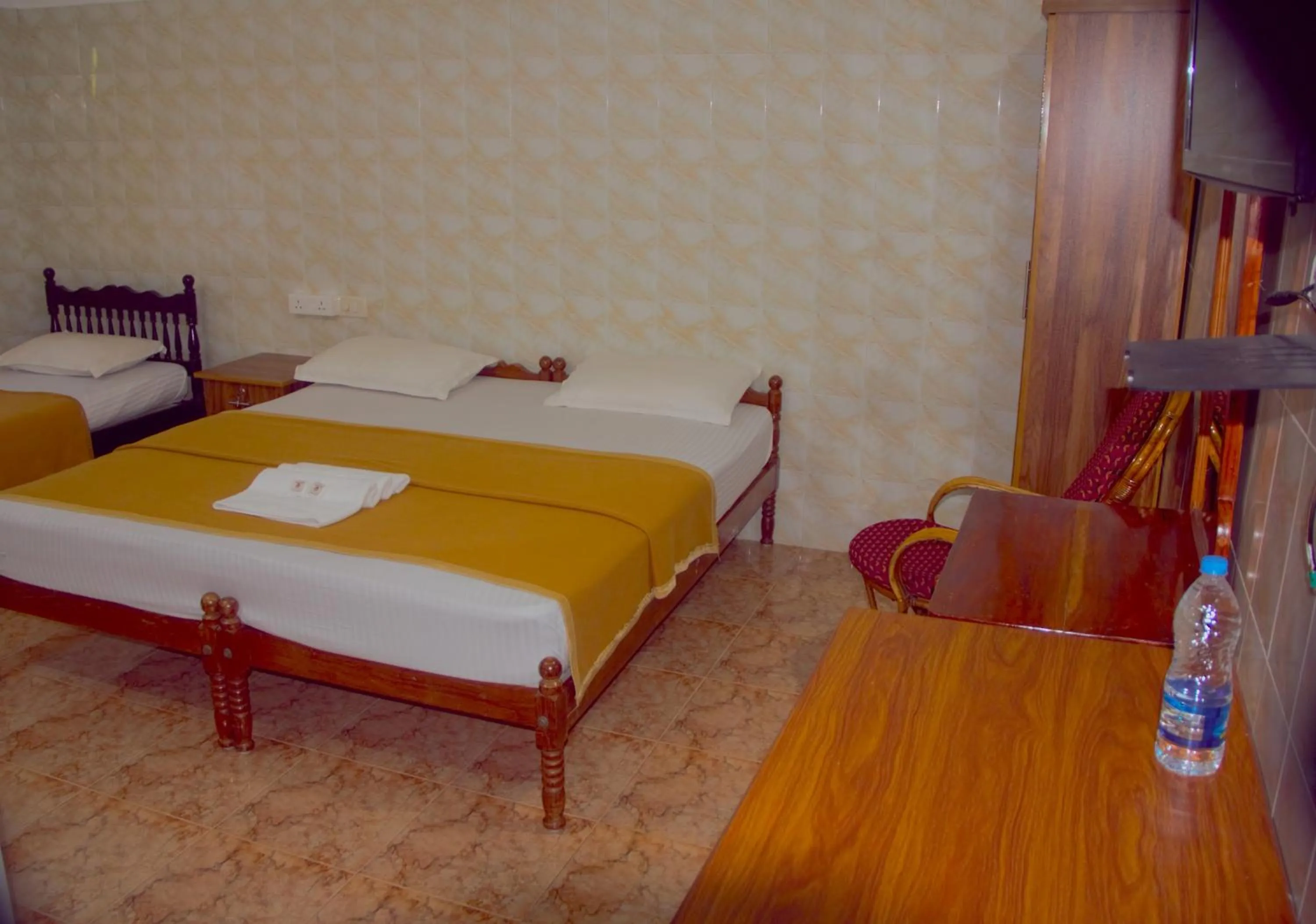 Bed in Lake Palace Family Resort Kumarakom