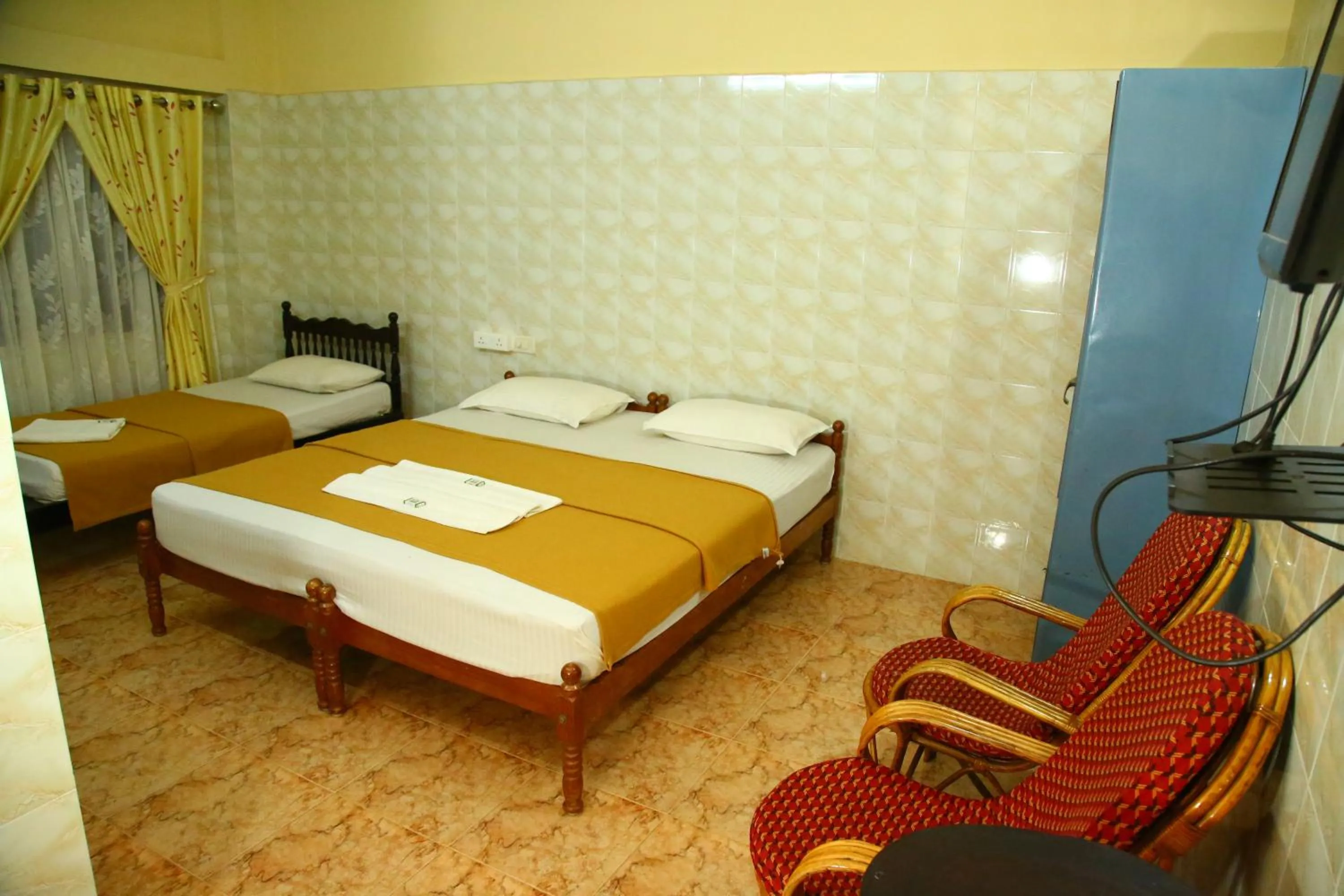 Bed in Lake Palace Family Resort Kumarakom