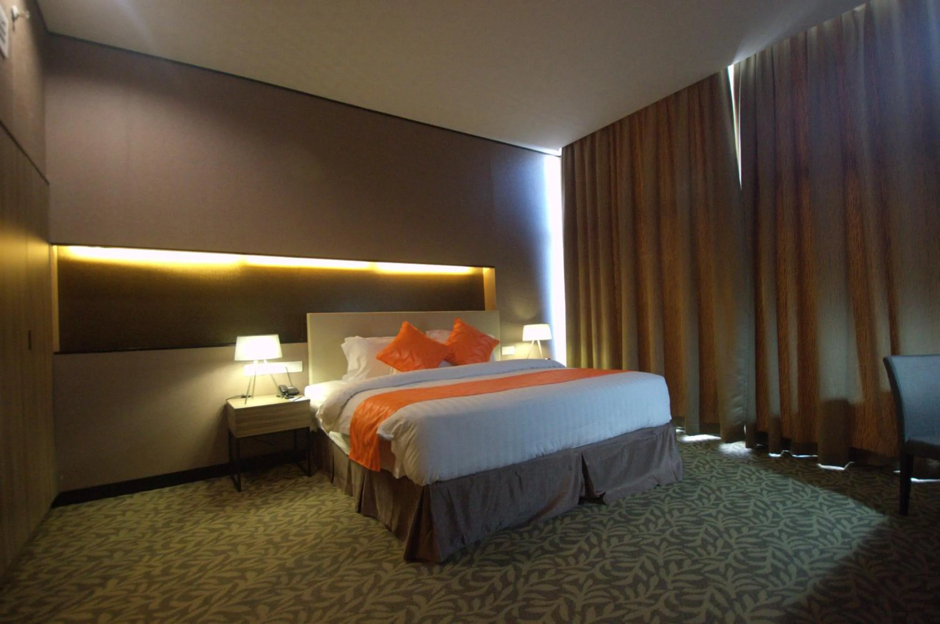 Photo of the whole room, Bed in Grand Alora Hotel