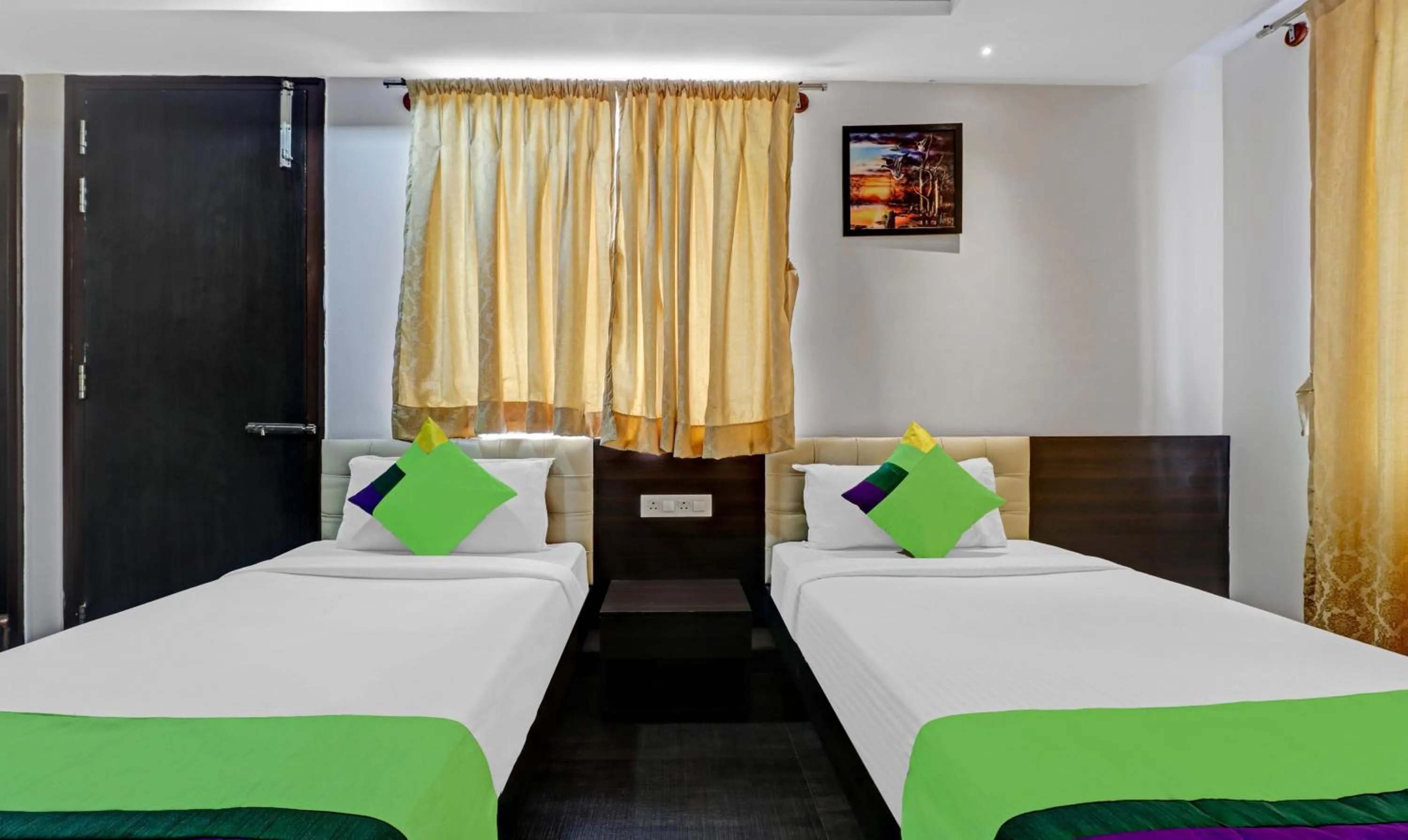 Bed in Treebo JJ Residency