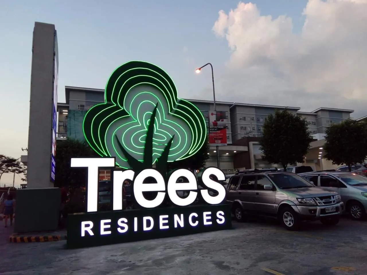 Property logo or sign in 2-Bedroom CK's Corner Staycation Trees Residences