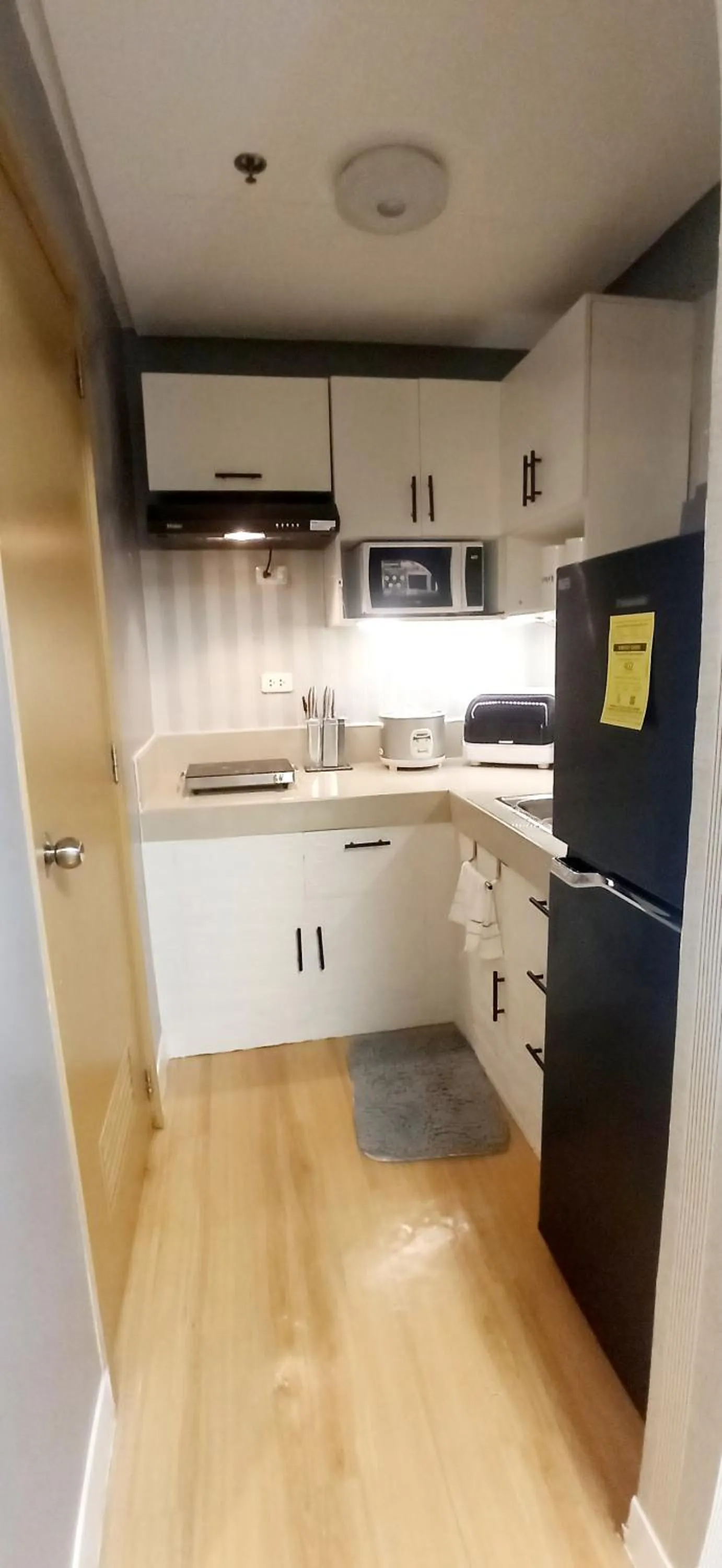 Kitchen or kitchenette in 2-Bedroom CK's Corner Staycation Trees Residences