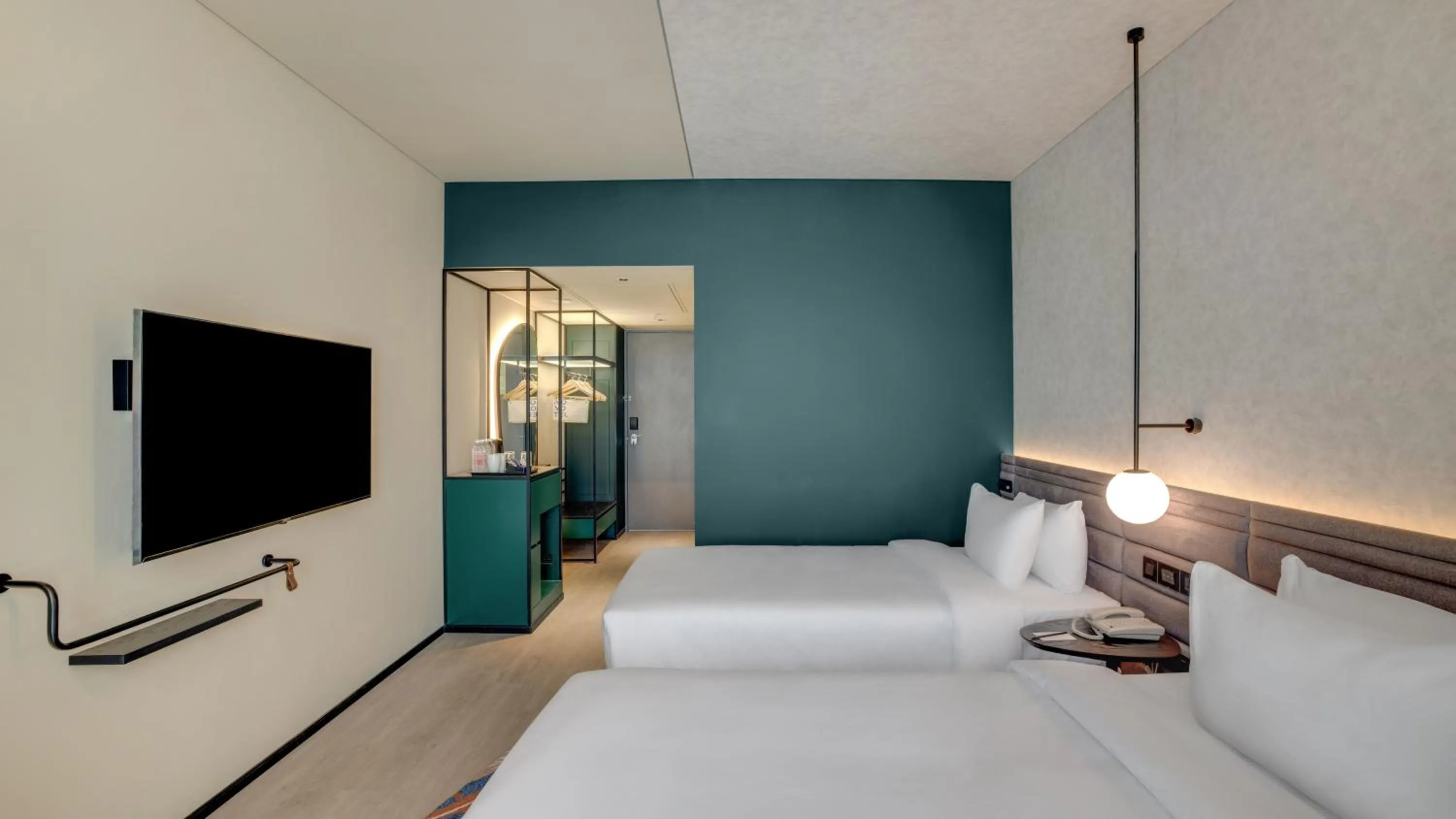 Communal lounge/ TV room, Bed in Novotel Pune Viman Nagar Road