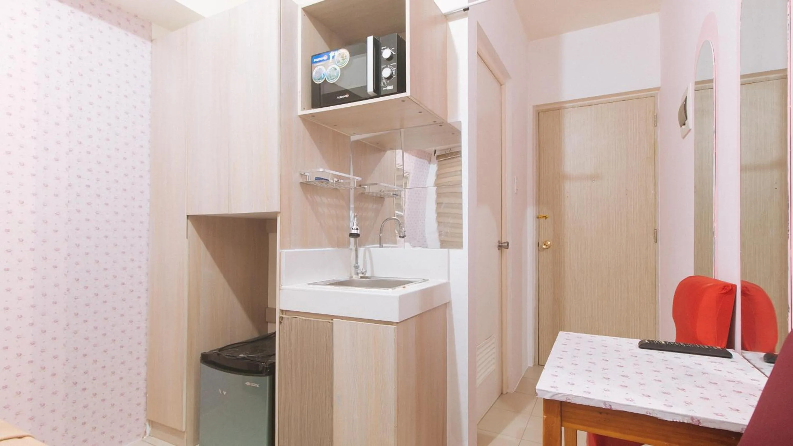 kitchen in Eimy's Place at Urban Deca Mandaluyong by RedDoorz