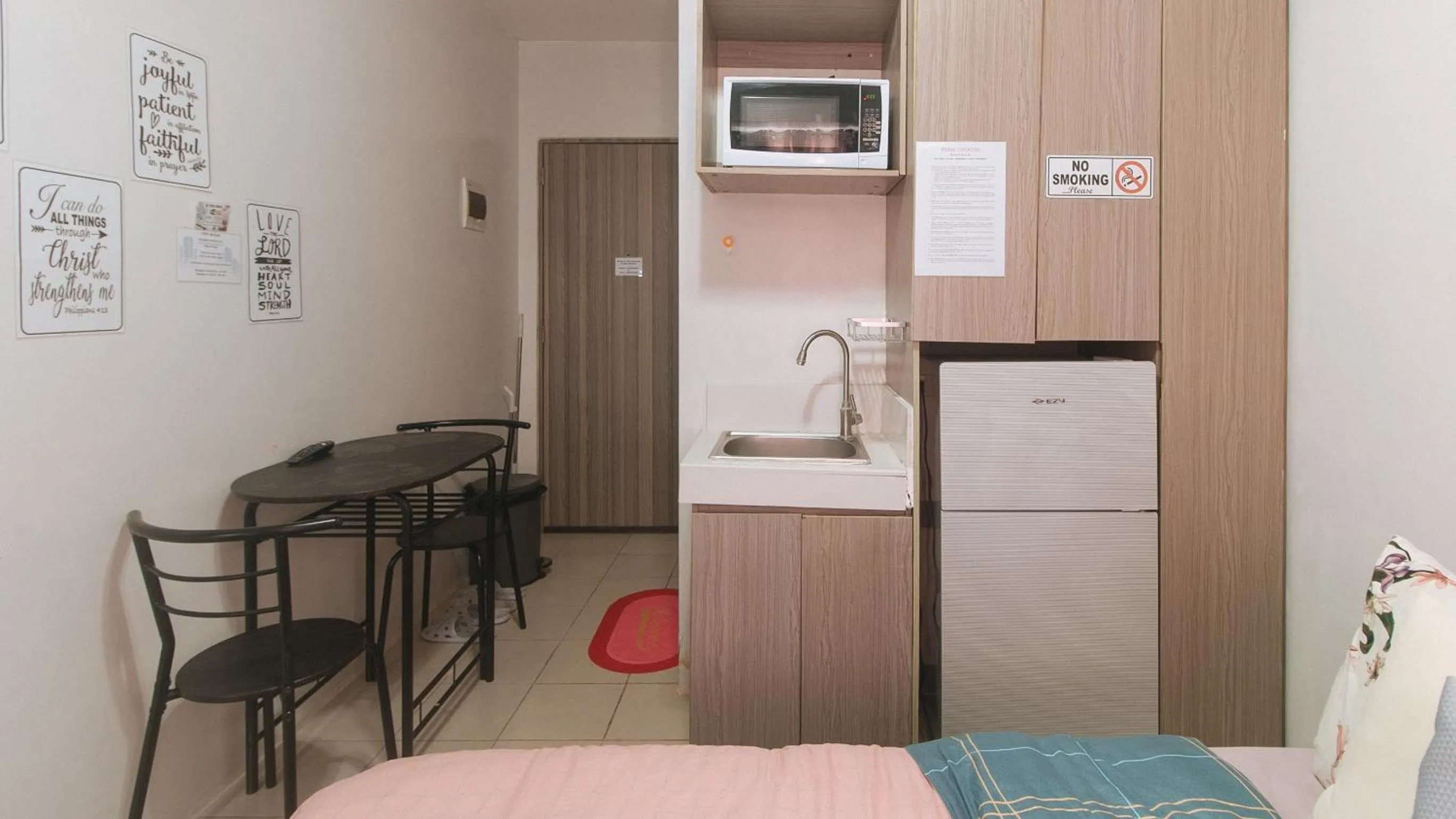 kitchen in Eimy's Place at Urban Deca Mandaluyong by RedDoorz