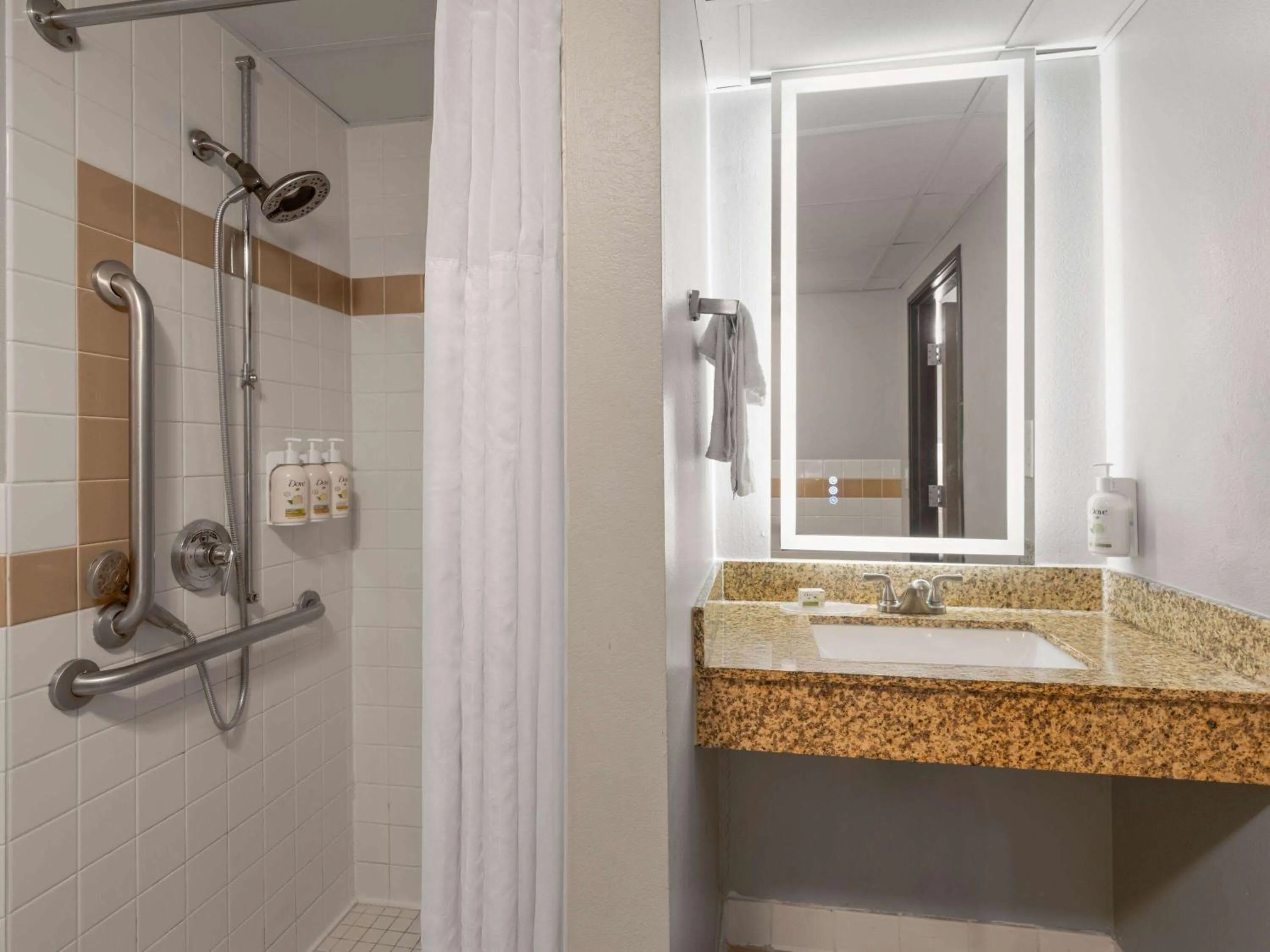 Shower in AmericInn by Wyndham Shakopee Near Canterbury Park