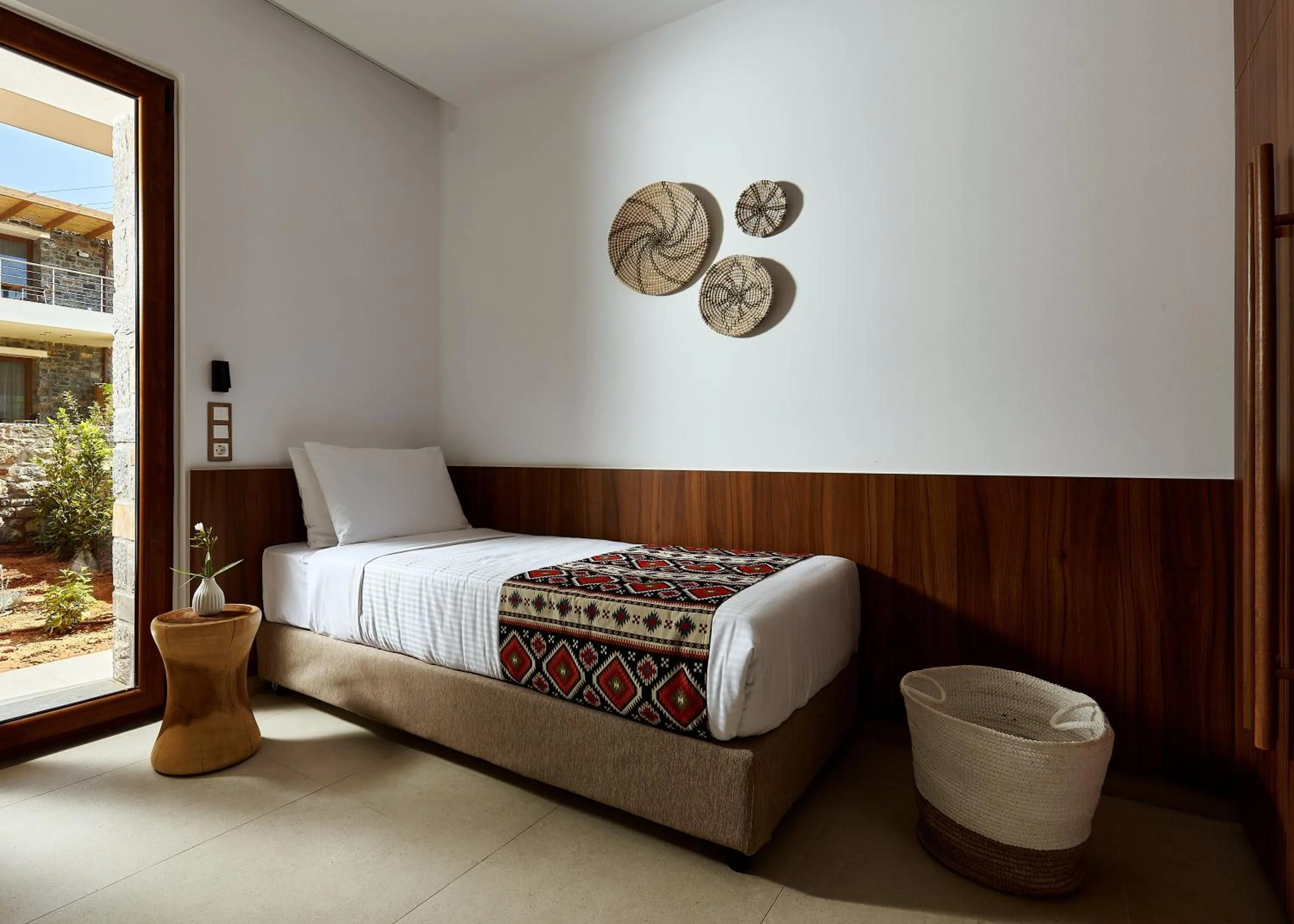 Bed in Volta Suites and Villas