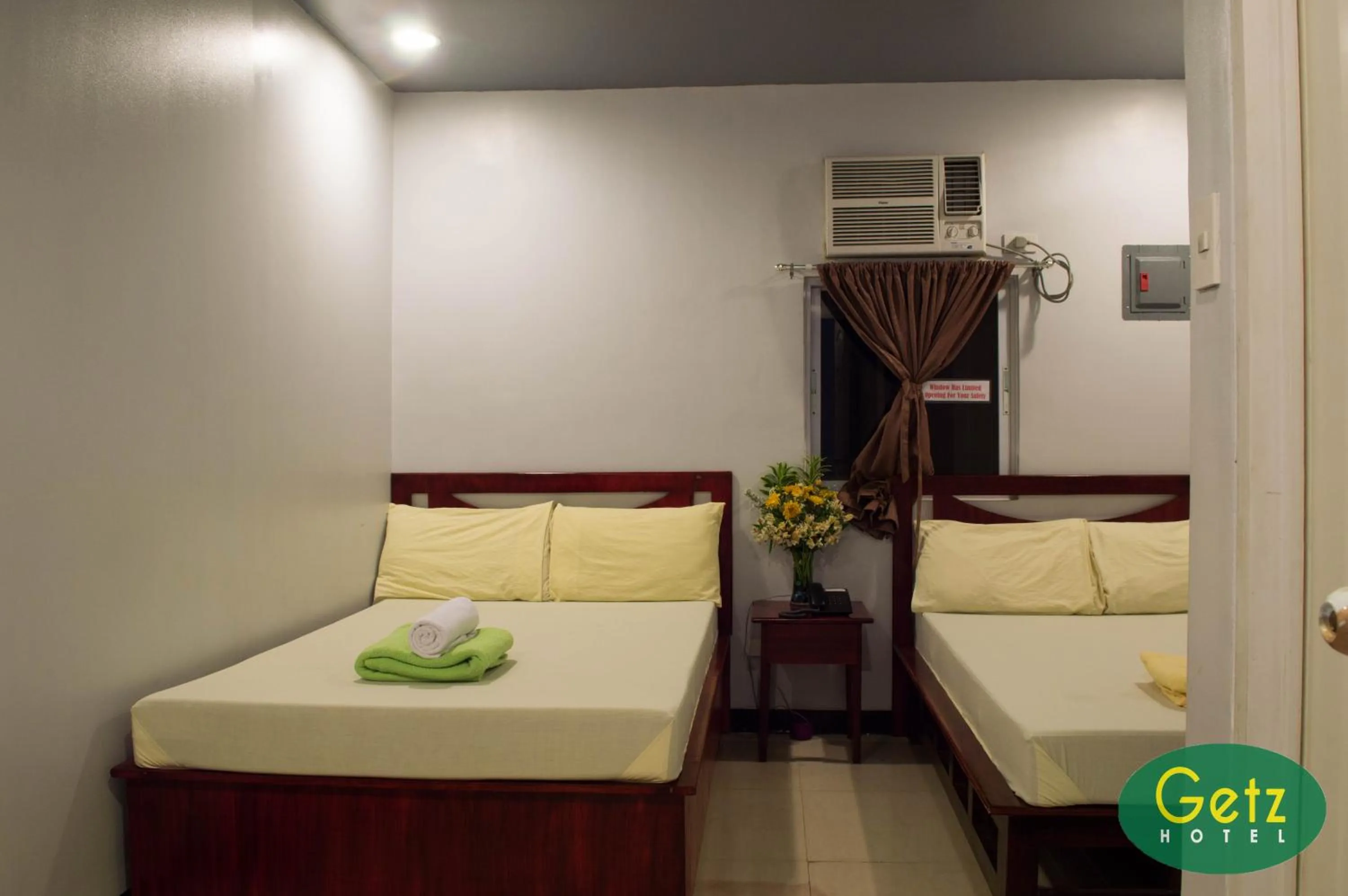 Bed in GETZ HOTEL MANILA