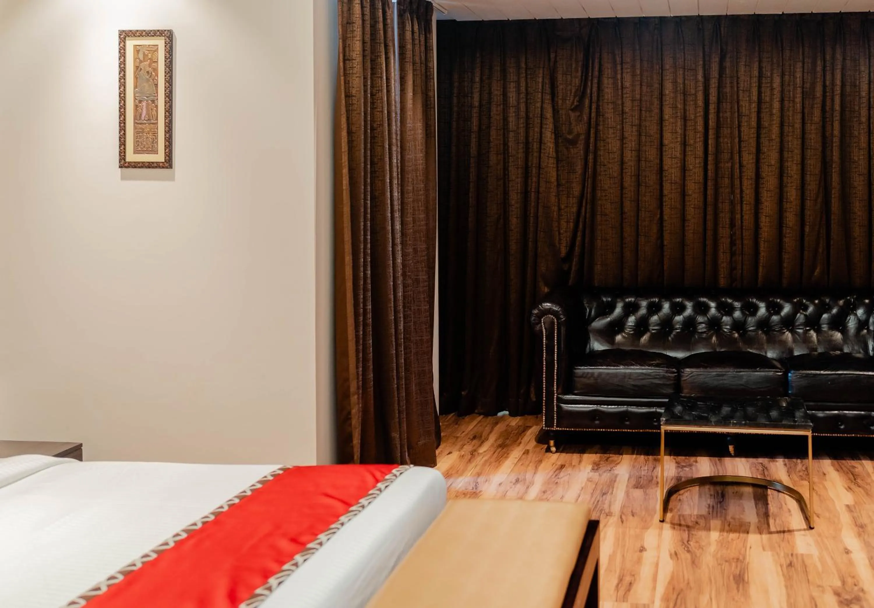 Seating area, Bed in Divan Clarks Inn Goa