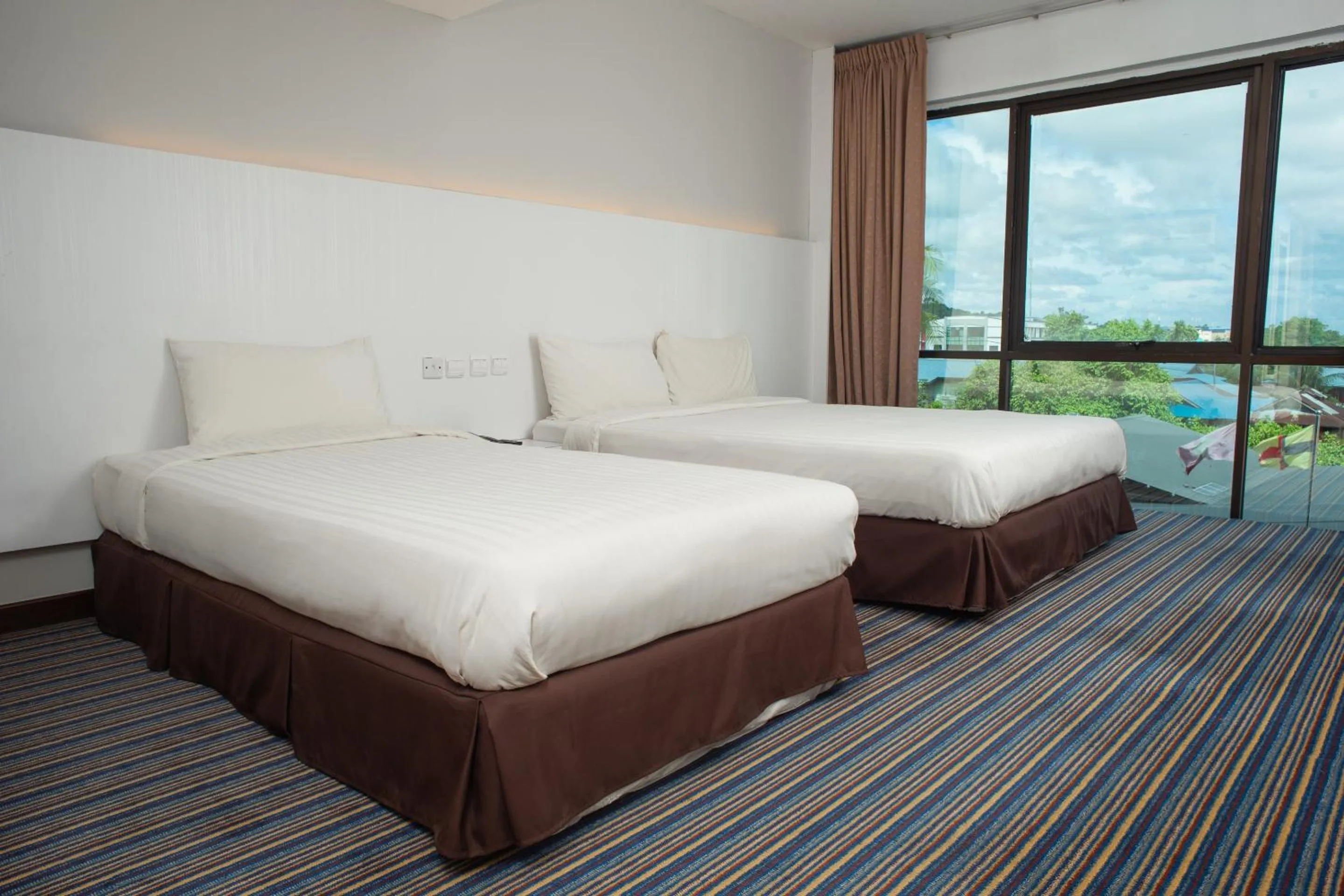 Bedroom in Capital O 90083 Riverfront Inn