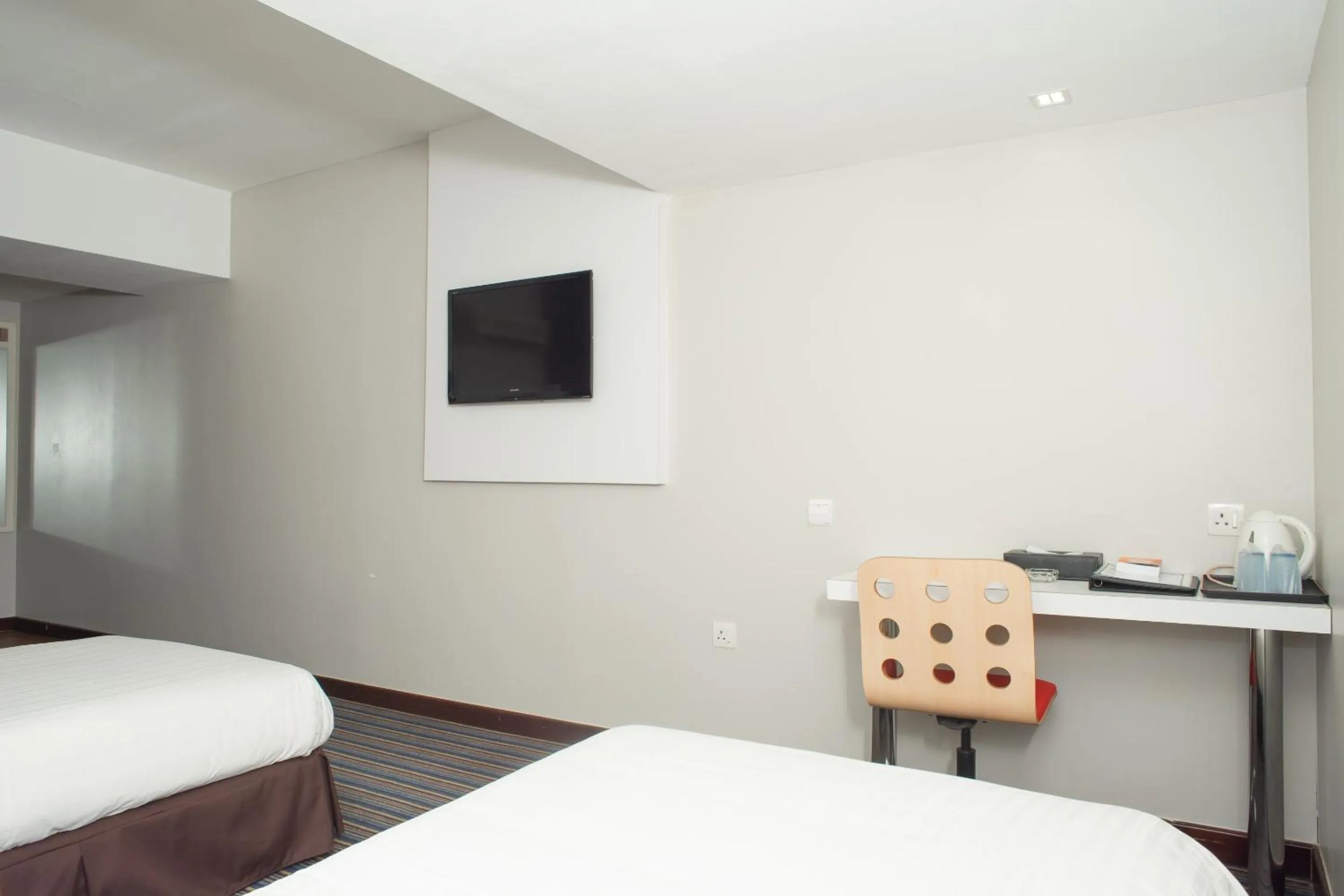 Bedroom in Capital O 90083 Riverfront Inn