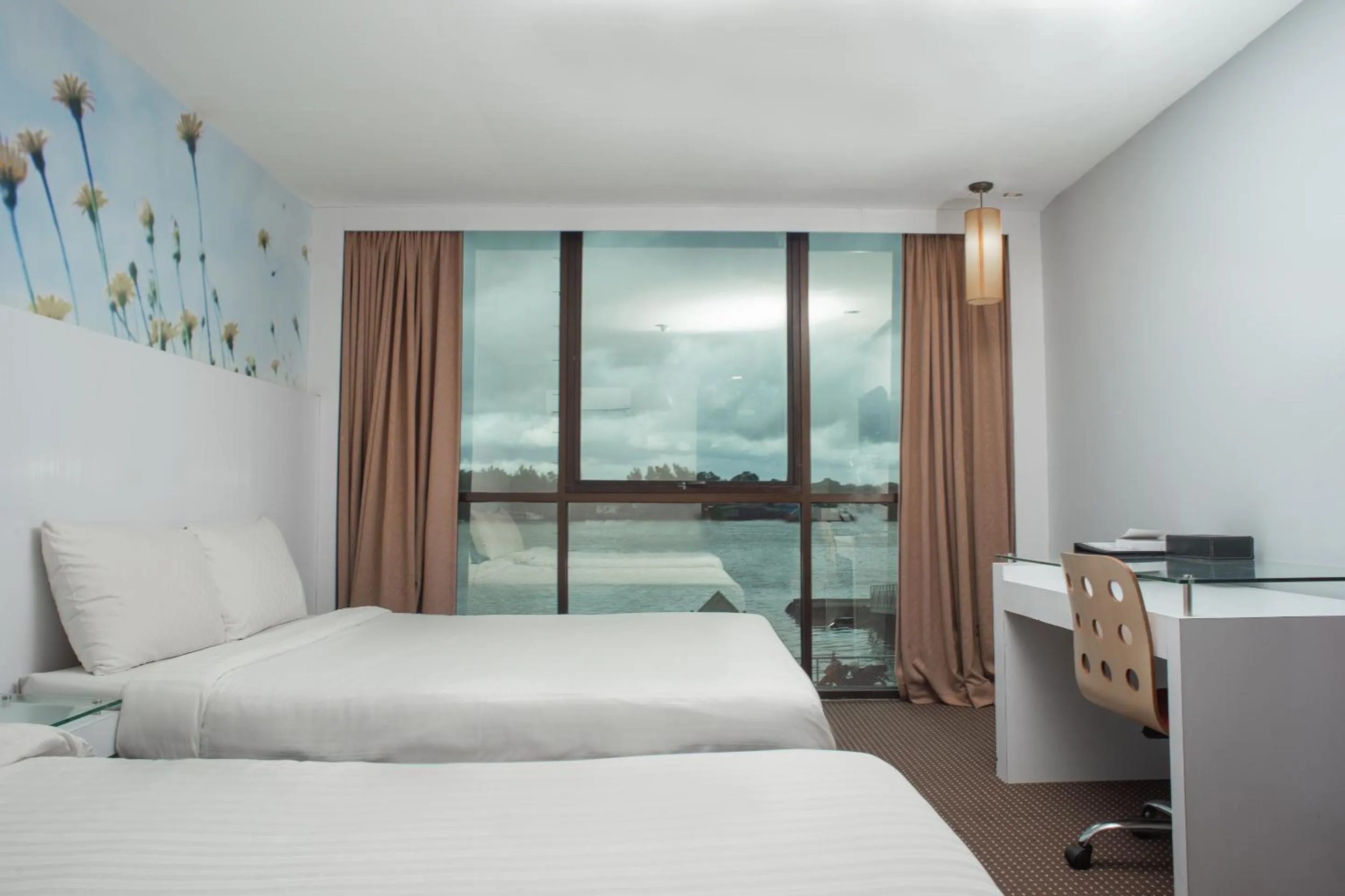 Bedroom in Capital O 90083 Riverfront Inn