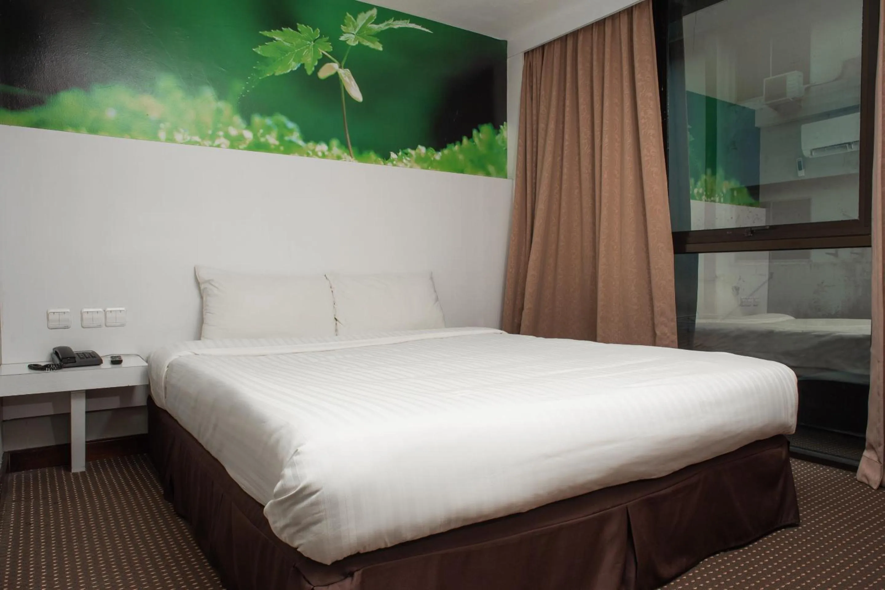 Bedroom in Capital O 90083 Riverfront Inn