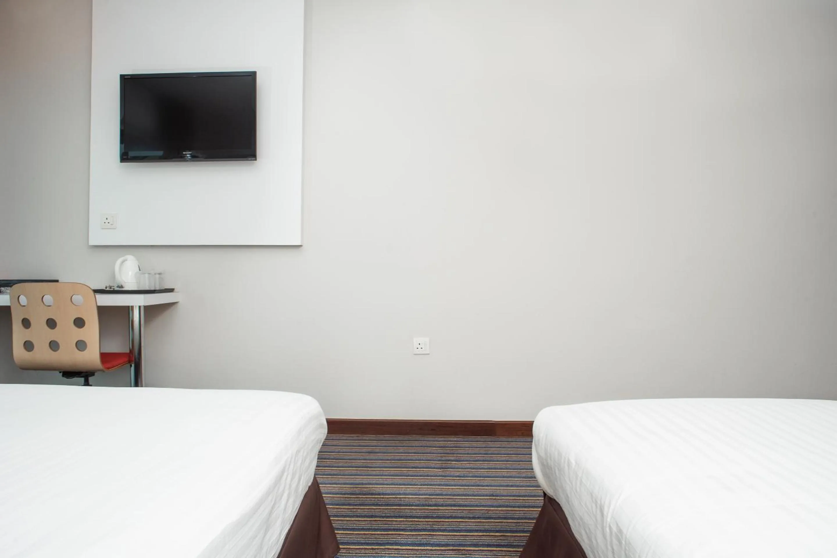 Bedroom in Capital O 90083 Riverfront Inn