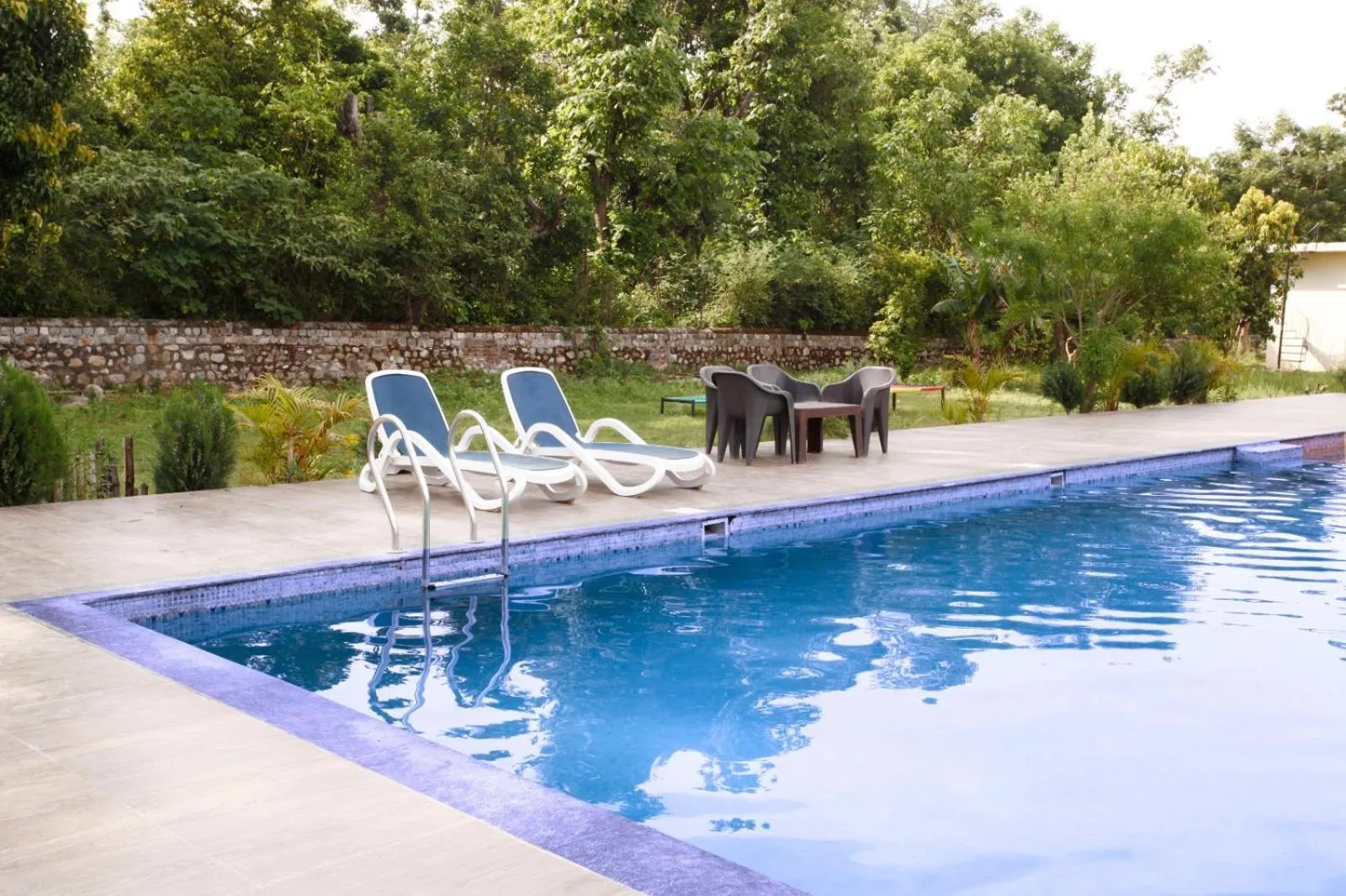 Swimming pool in Vanasthali Jungle Resort Jim Corbett