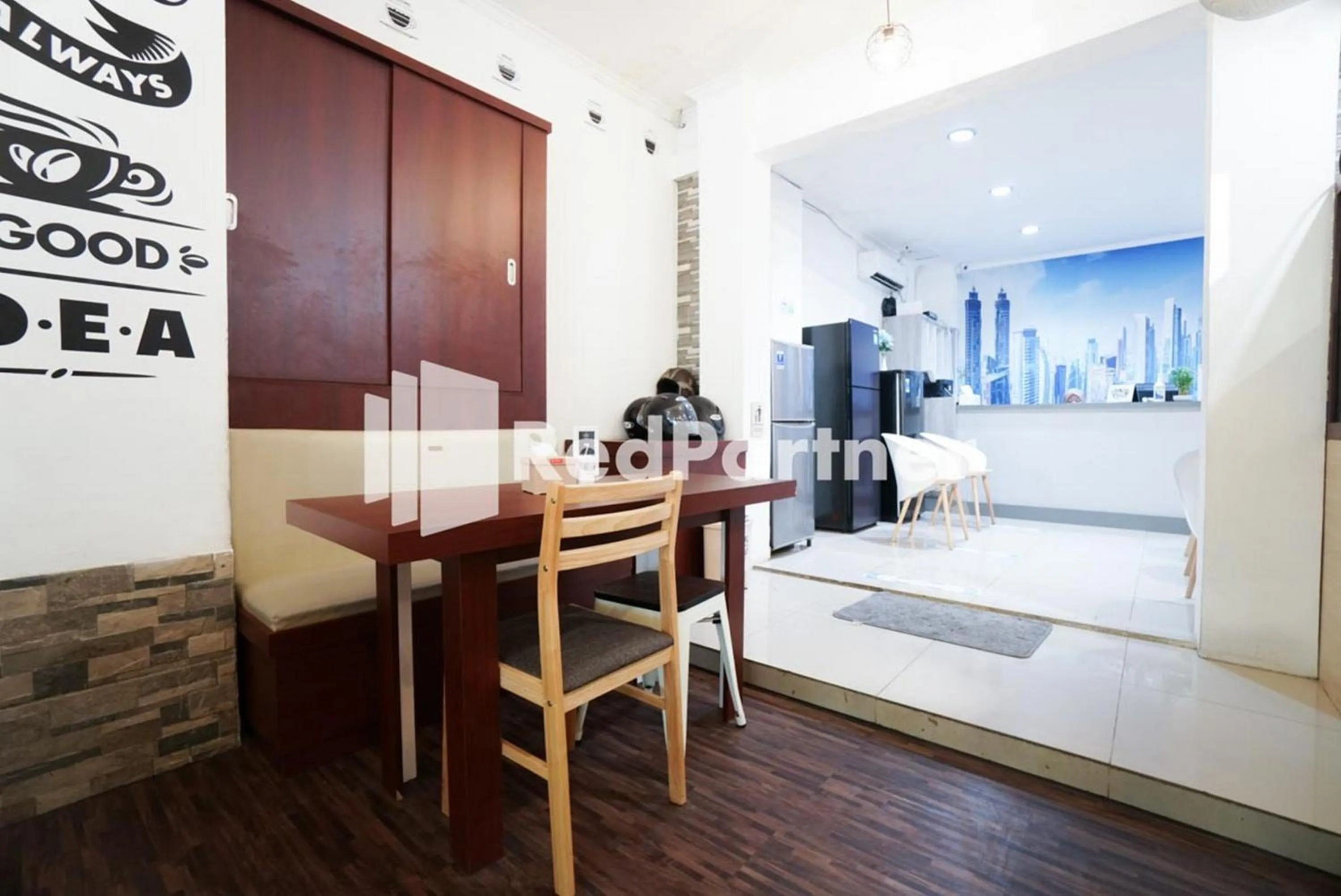 Seating area, Bed in Eascot Hotel Mitra RedDoorz