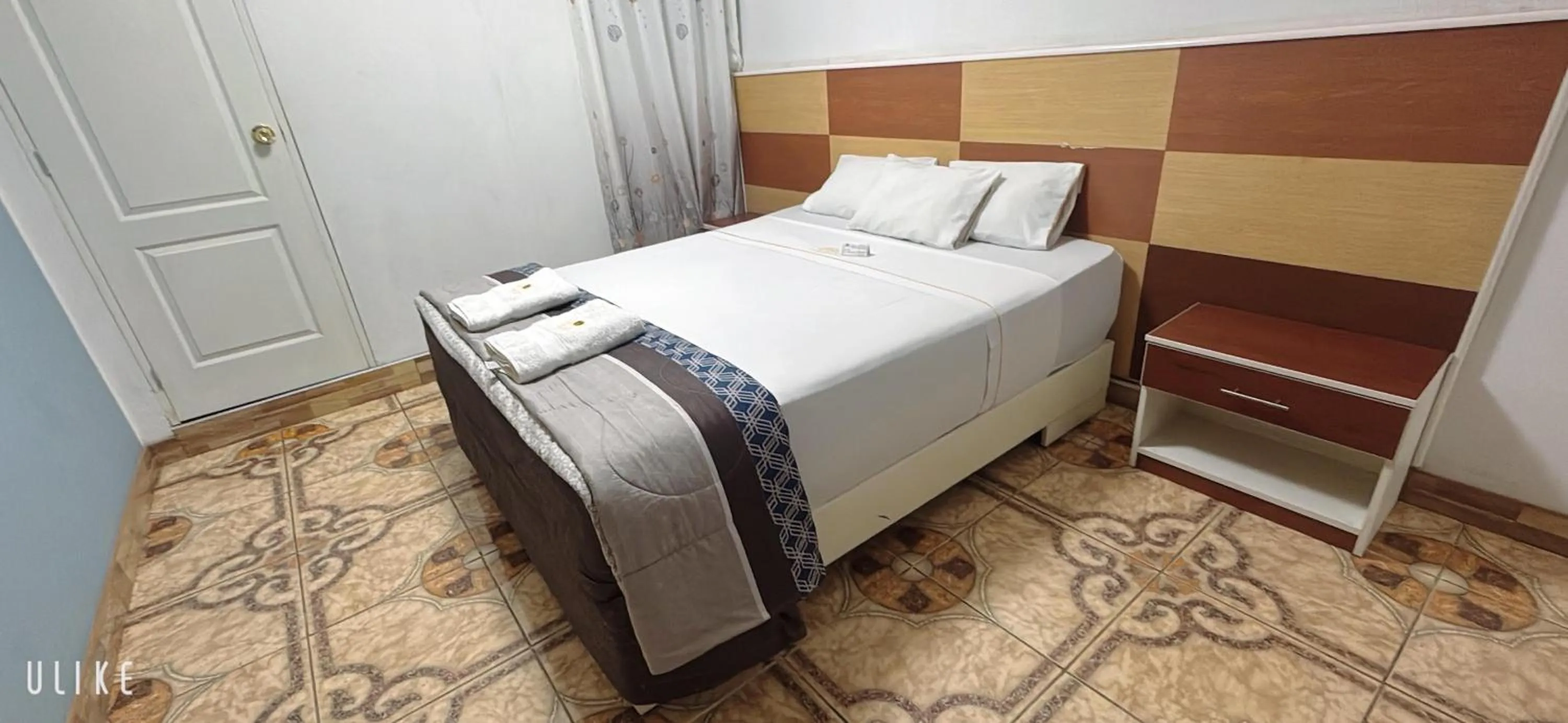 Bed in San Isidro Grand Hotel