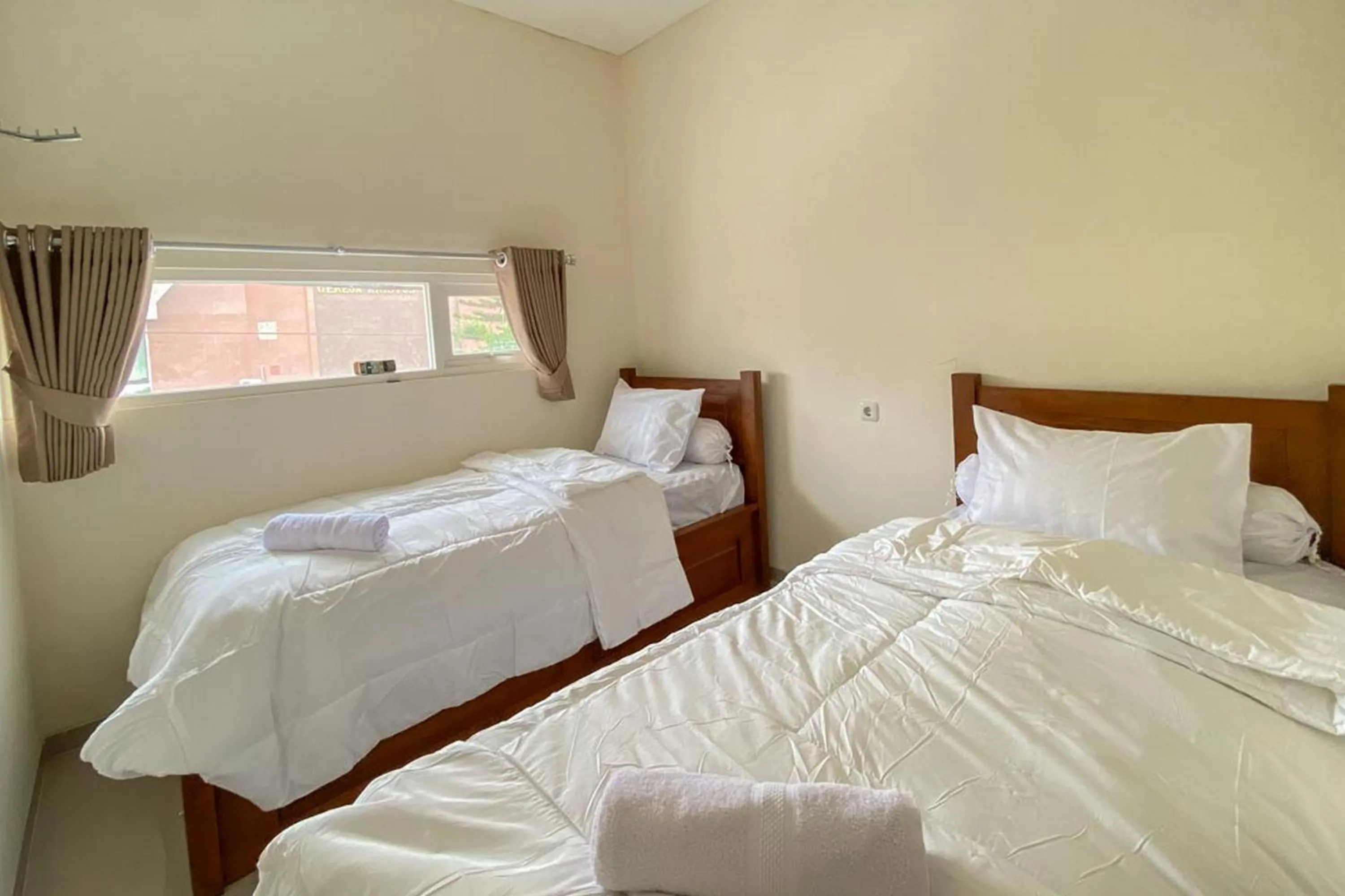 Bed in Nipa Guest House near Universitas Widyagama Mitra RedDoorz