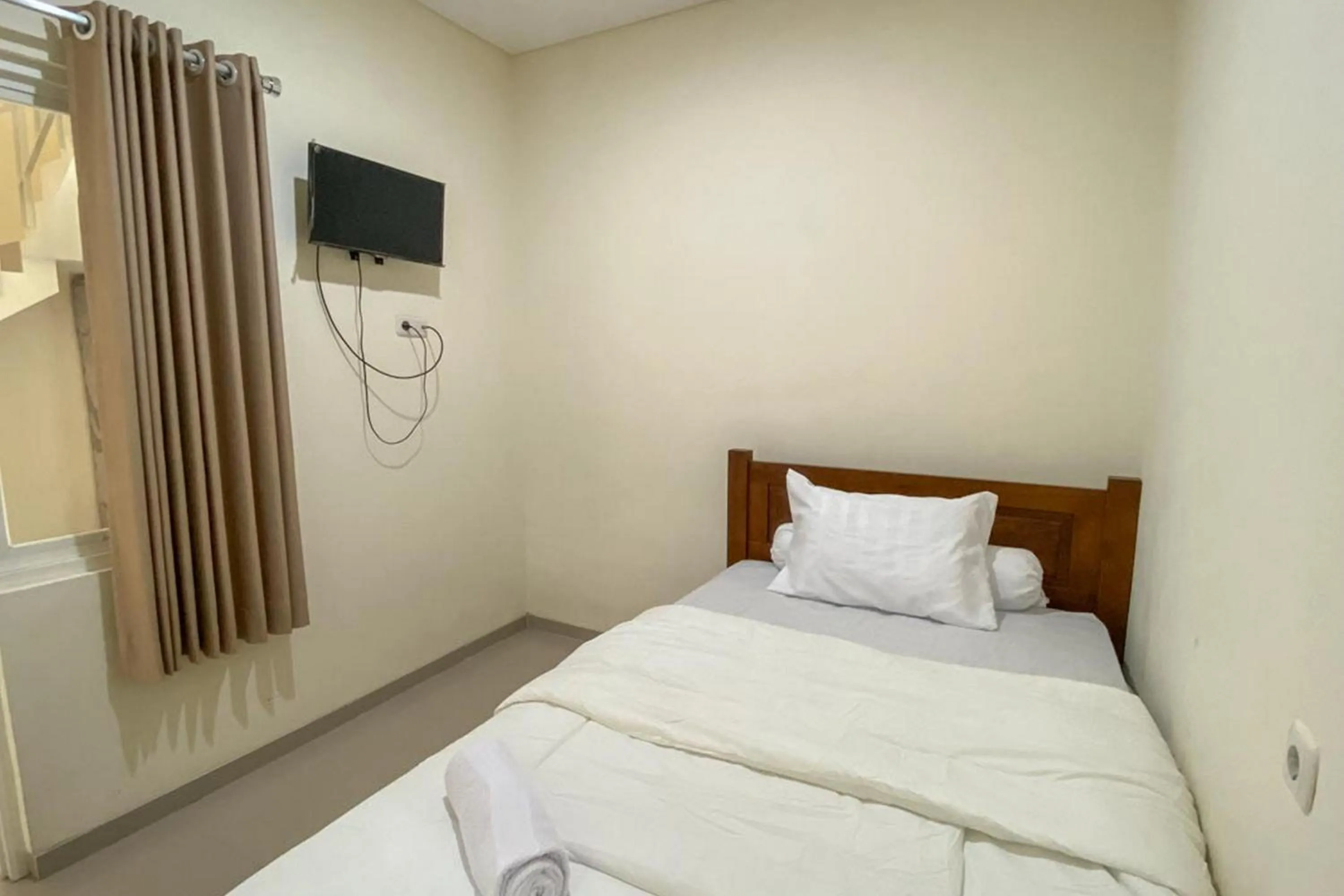 Bed in Nipa Guest House near Universitas Widyagama Mitra RedDoorz