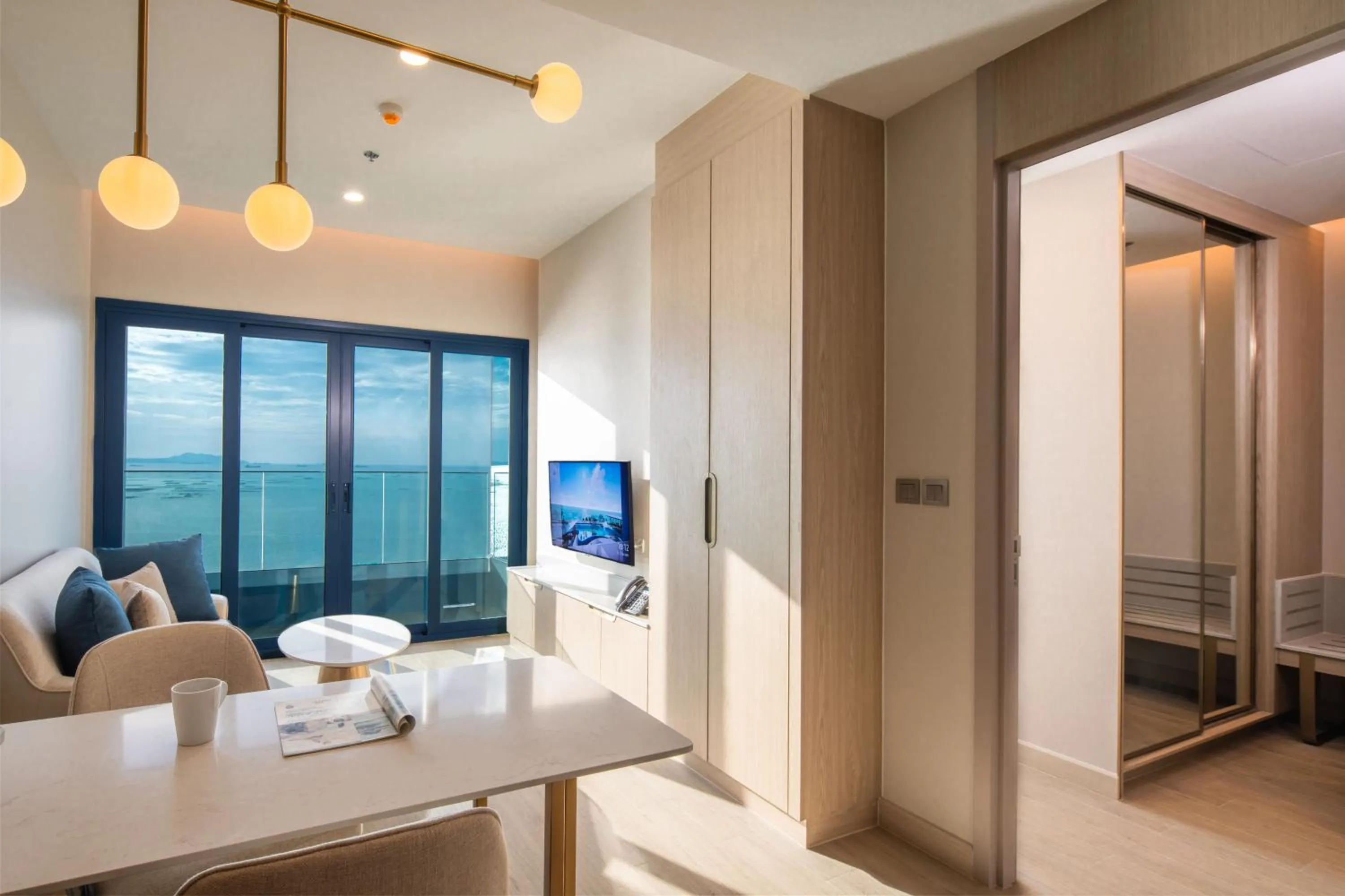 Living room, Bed in S Sriracha Hotel & Residence