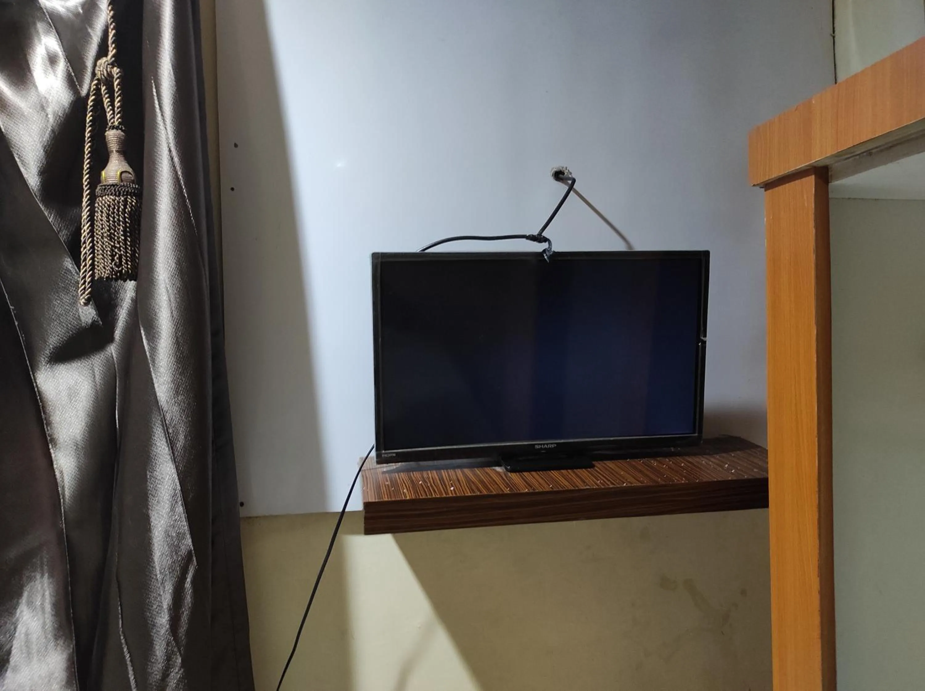 Bedroom in OYO 93411 Syariah Hotel Tomborang