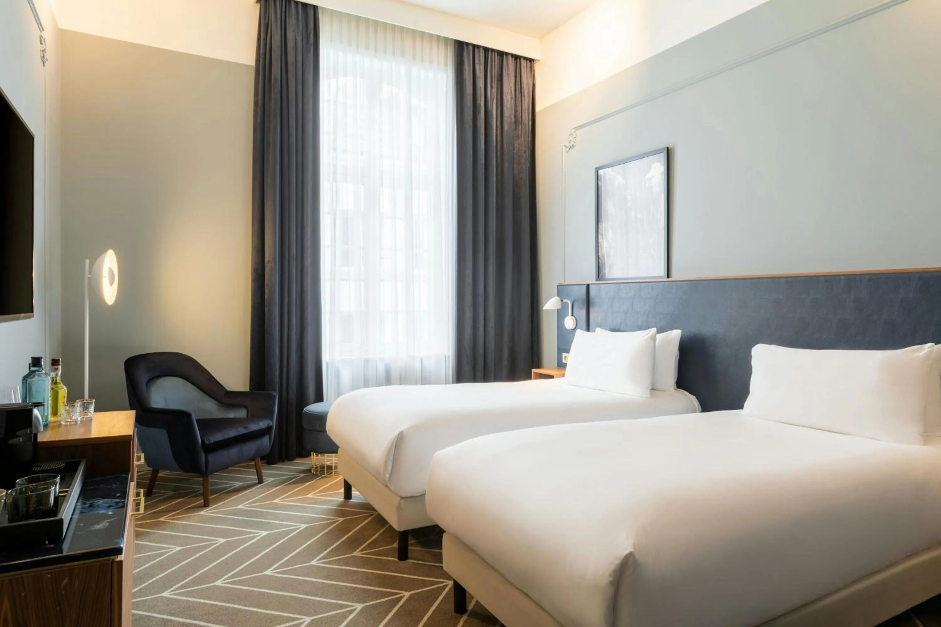 Photo of the whole room, Bed in Sapphire House Antwerp, Autograph Collection